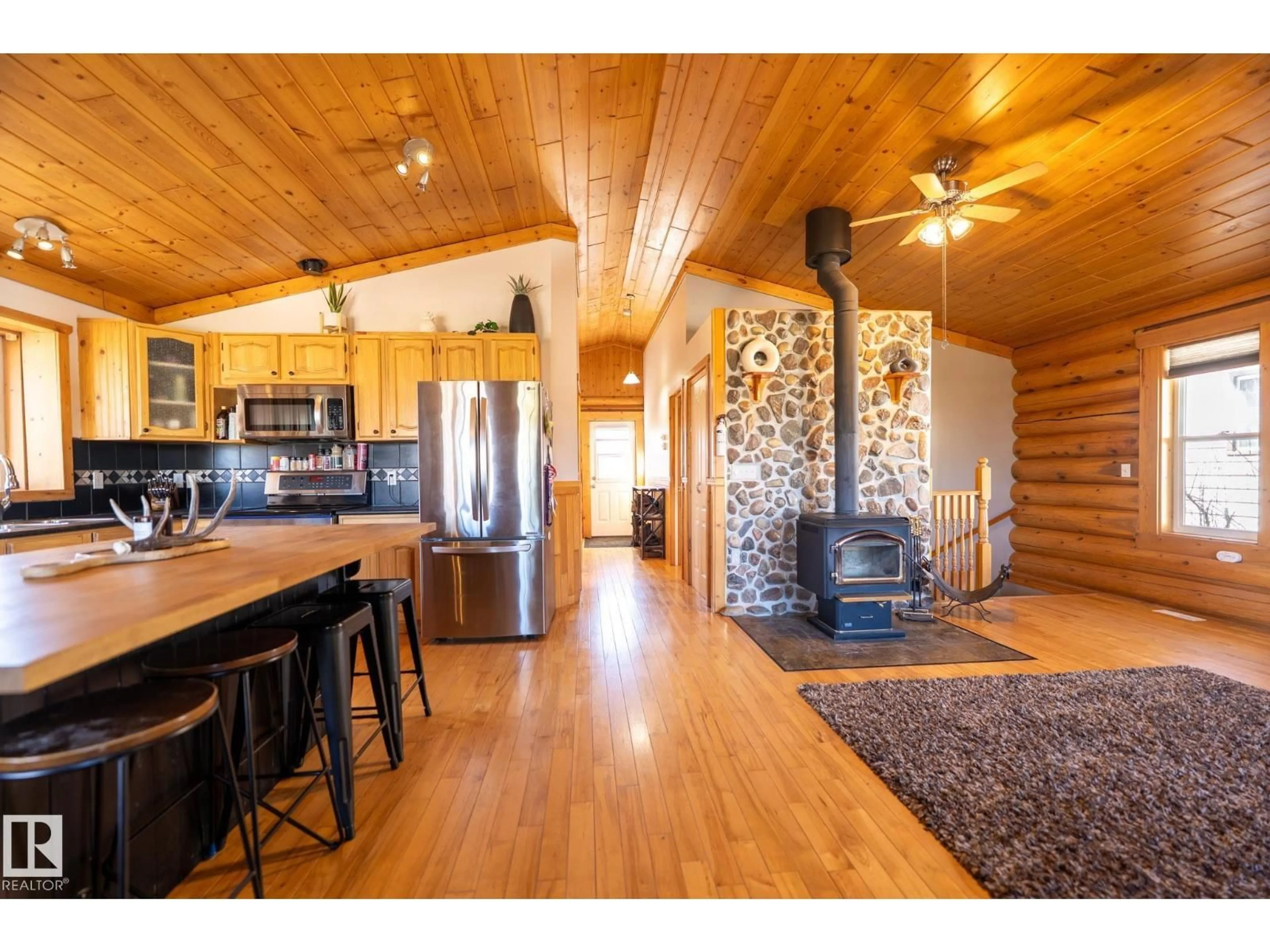 Open concept kitchen, wood/laminate floor for 4707 47 AV, Bruderheim Alberta T0B0S0
