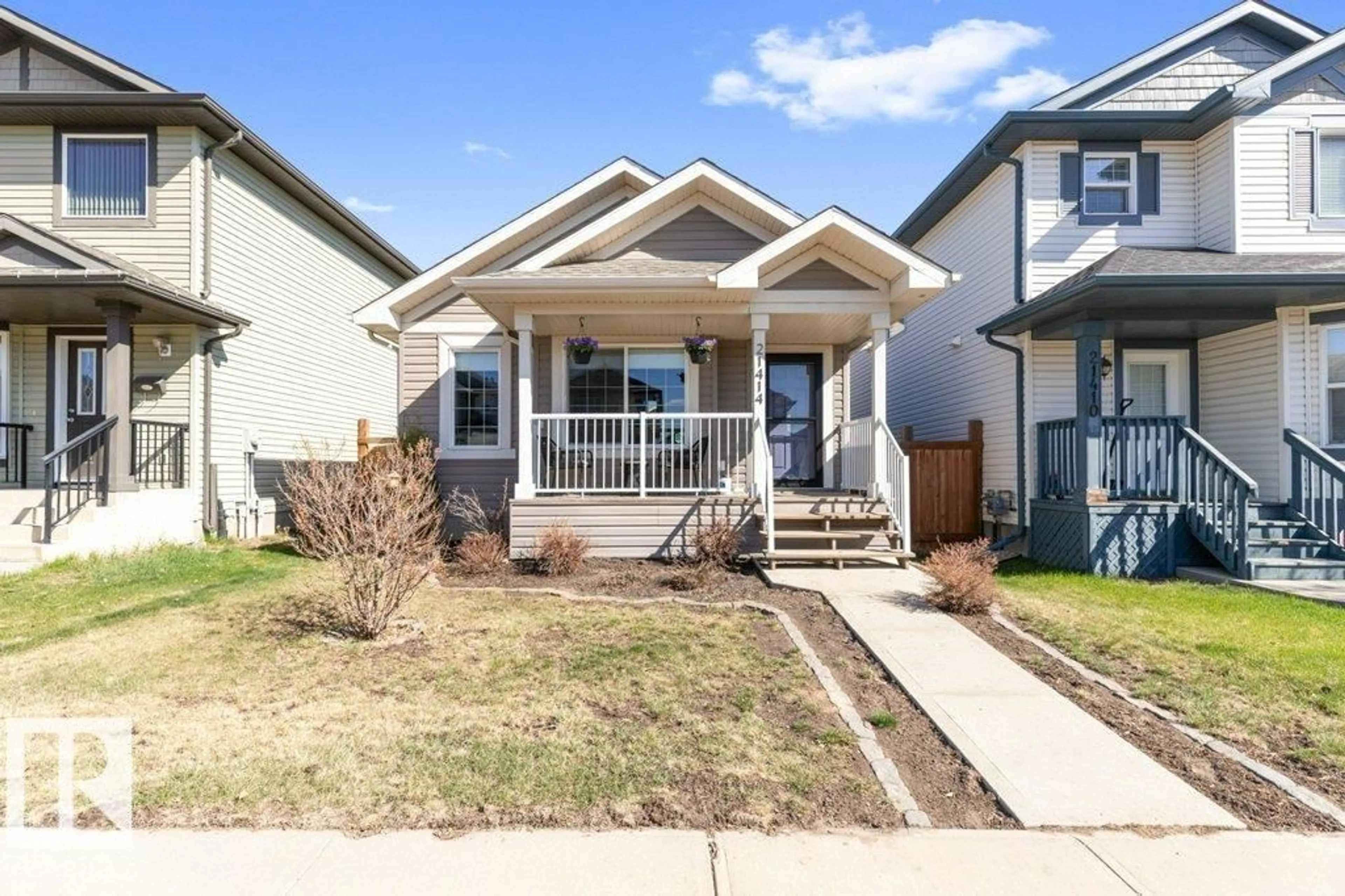 Home with vinyl exterior material, street for 21414 94A AV, Edmonton Alberta T5T4E3