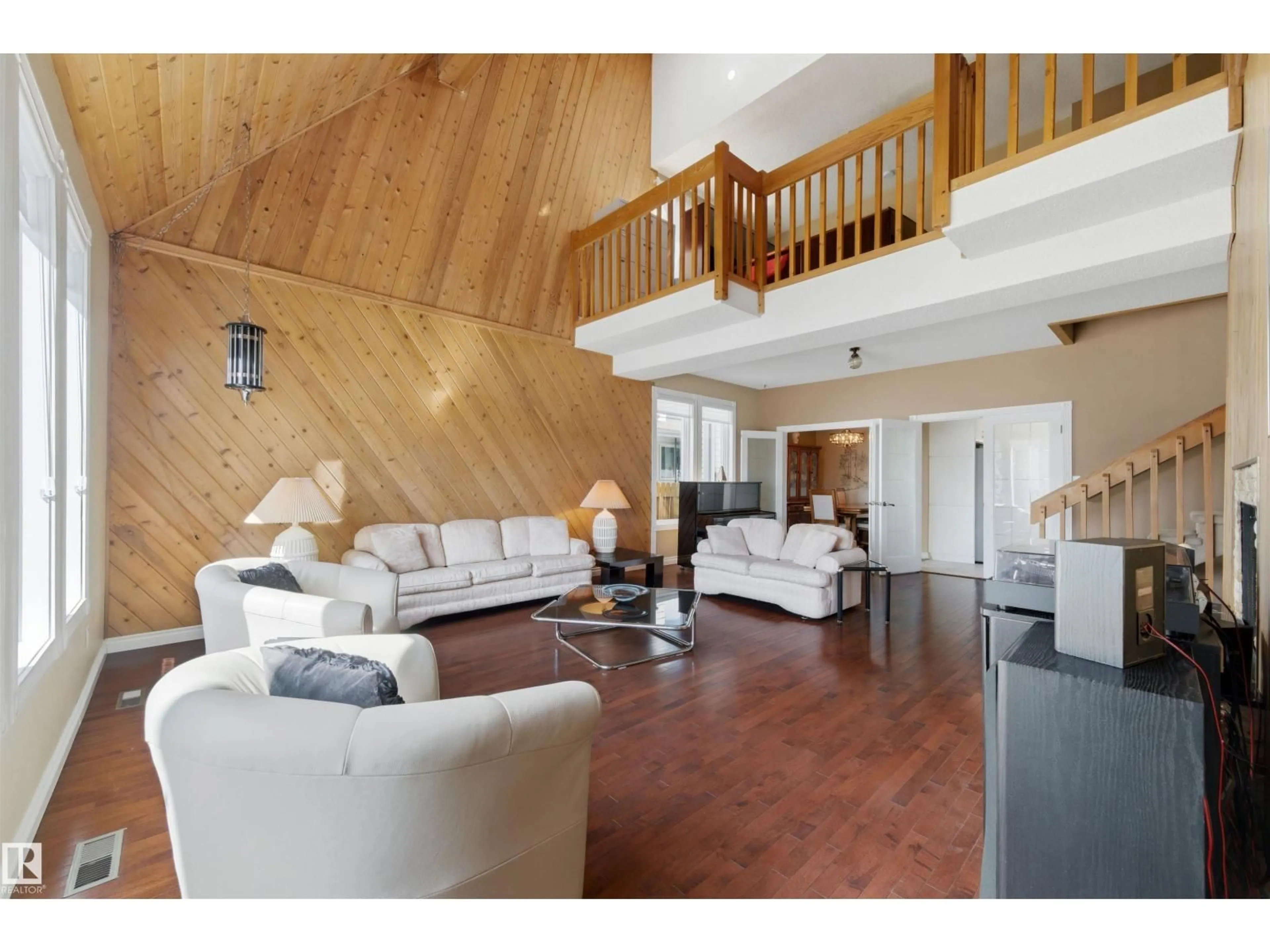 Living room with furniture, wood/laminate floor for NW - 11212 35 AV, Edmonton Alberta T6J3N1