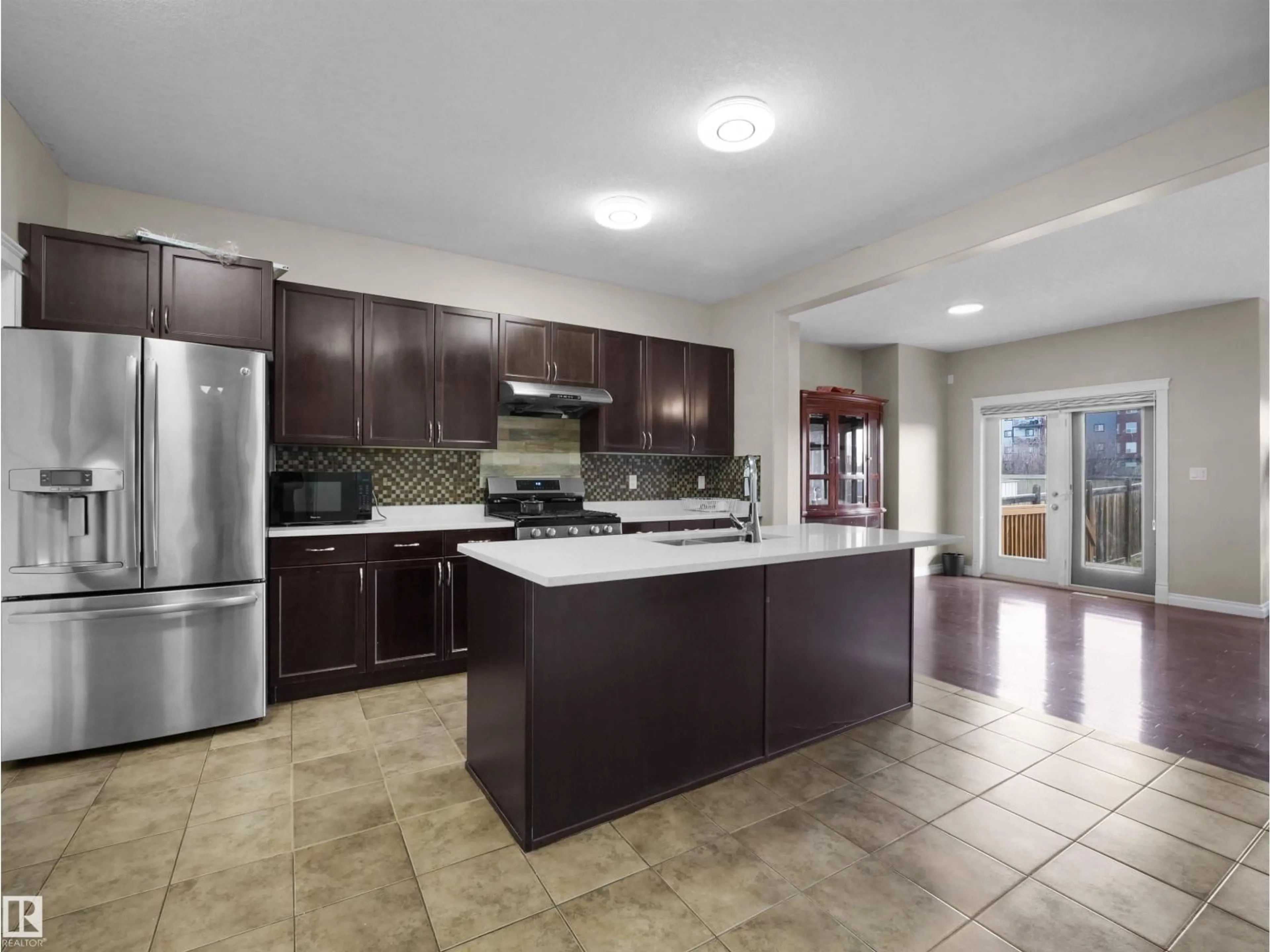 Open concept kitchen, ceramic/tile floor for 2511 29 ST, Edmonton Alberta T6T0G8
