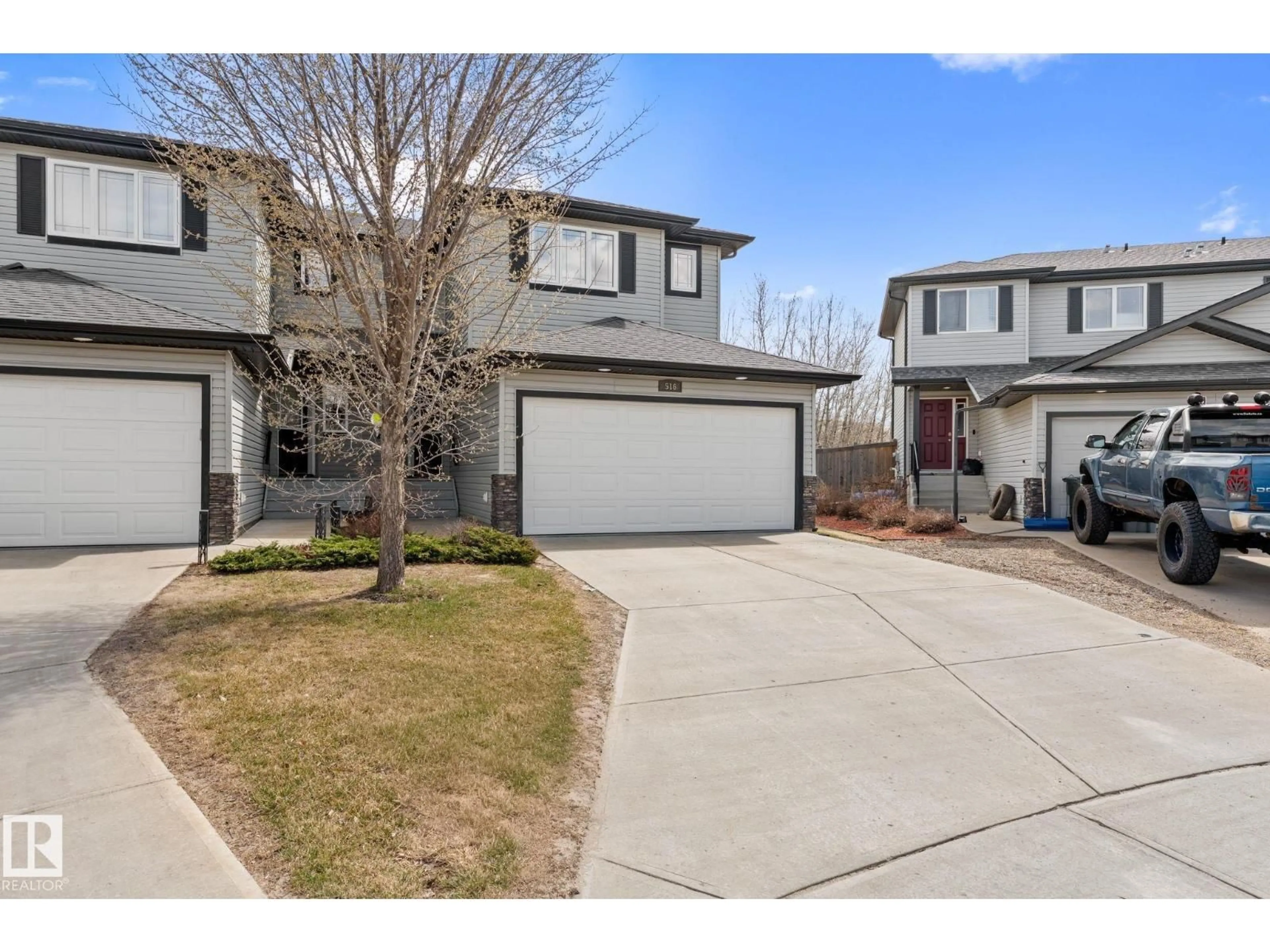 A pic from outside/outdoor area/front of a property/back of a property/a pic from drone, street for 516 FAIRWAY TC, Stony Plain Alberta T7Z0G9