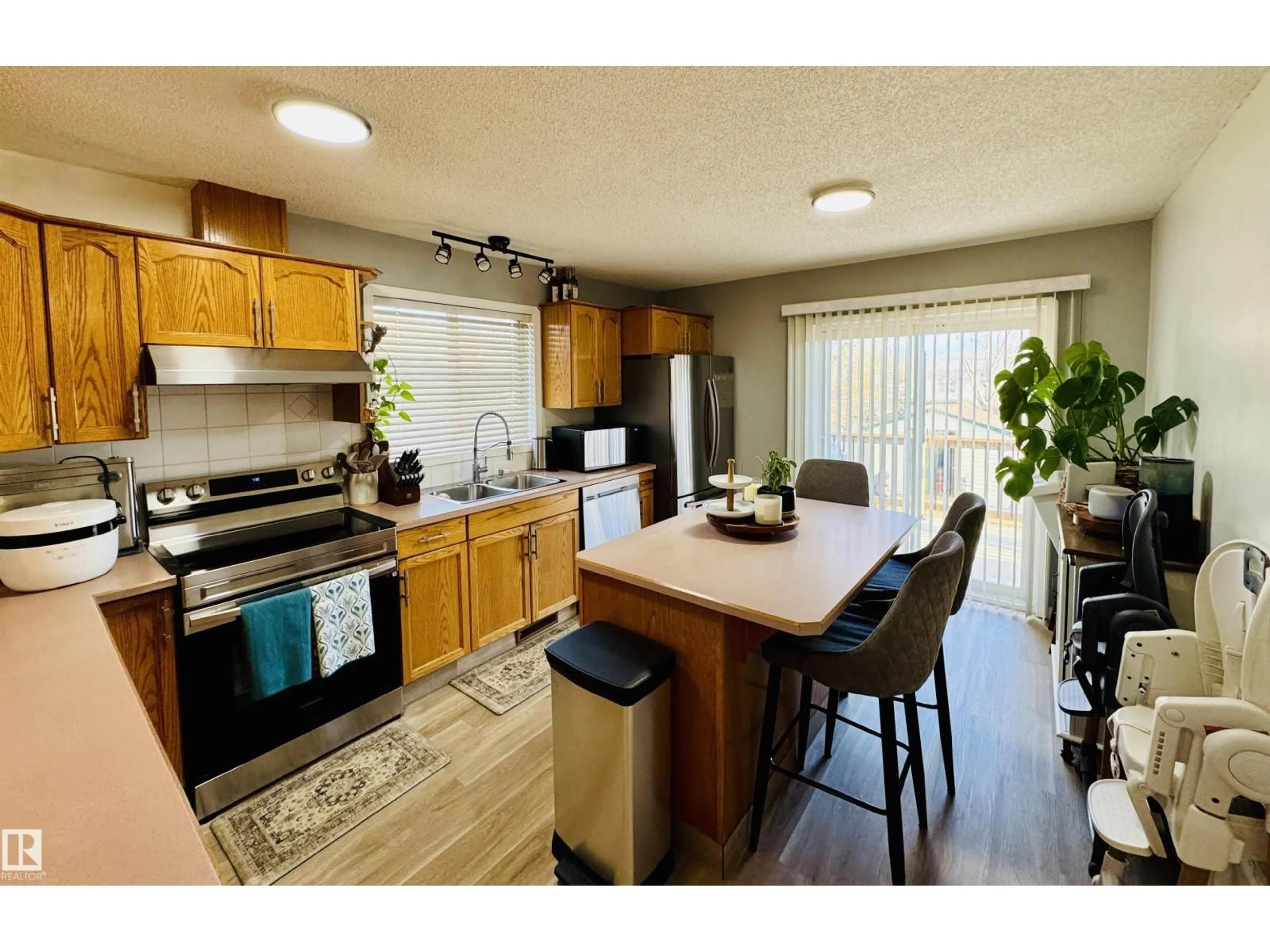 Open concept kitchen, wood/laminate floor for 5537 54 AV, St. Paul Town Alberta T0A3A1