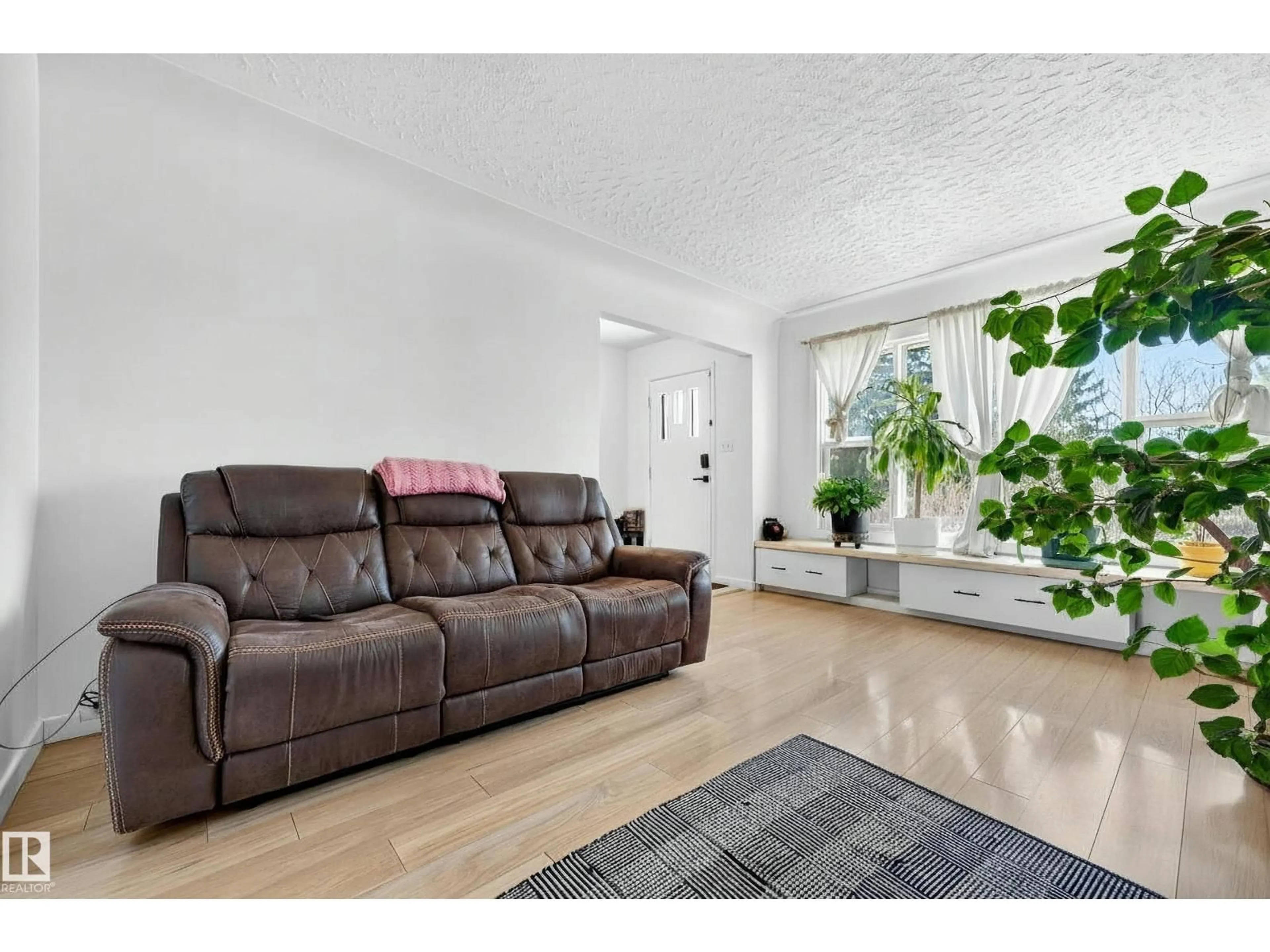 Living room with furniture, unknown for 13620 119 AV, Edmonton Alberta T5L2N6