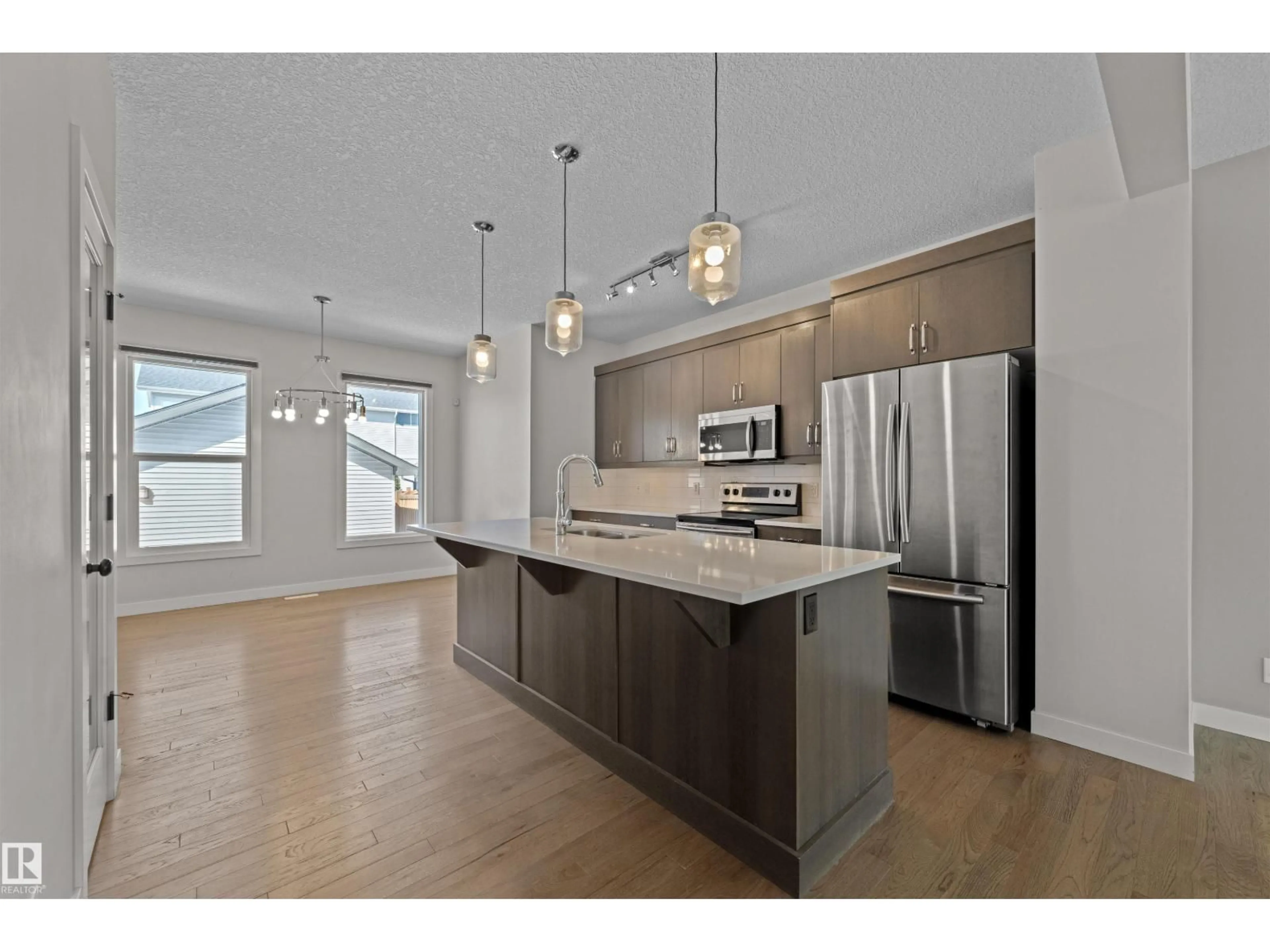 Open concept kitchen, wood/laminate floor for SW - 6906 CARDINAL WD, Edmonton Alberta T6W2Y4