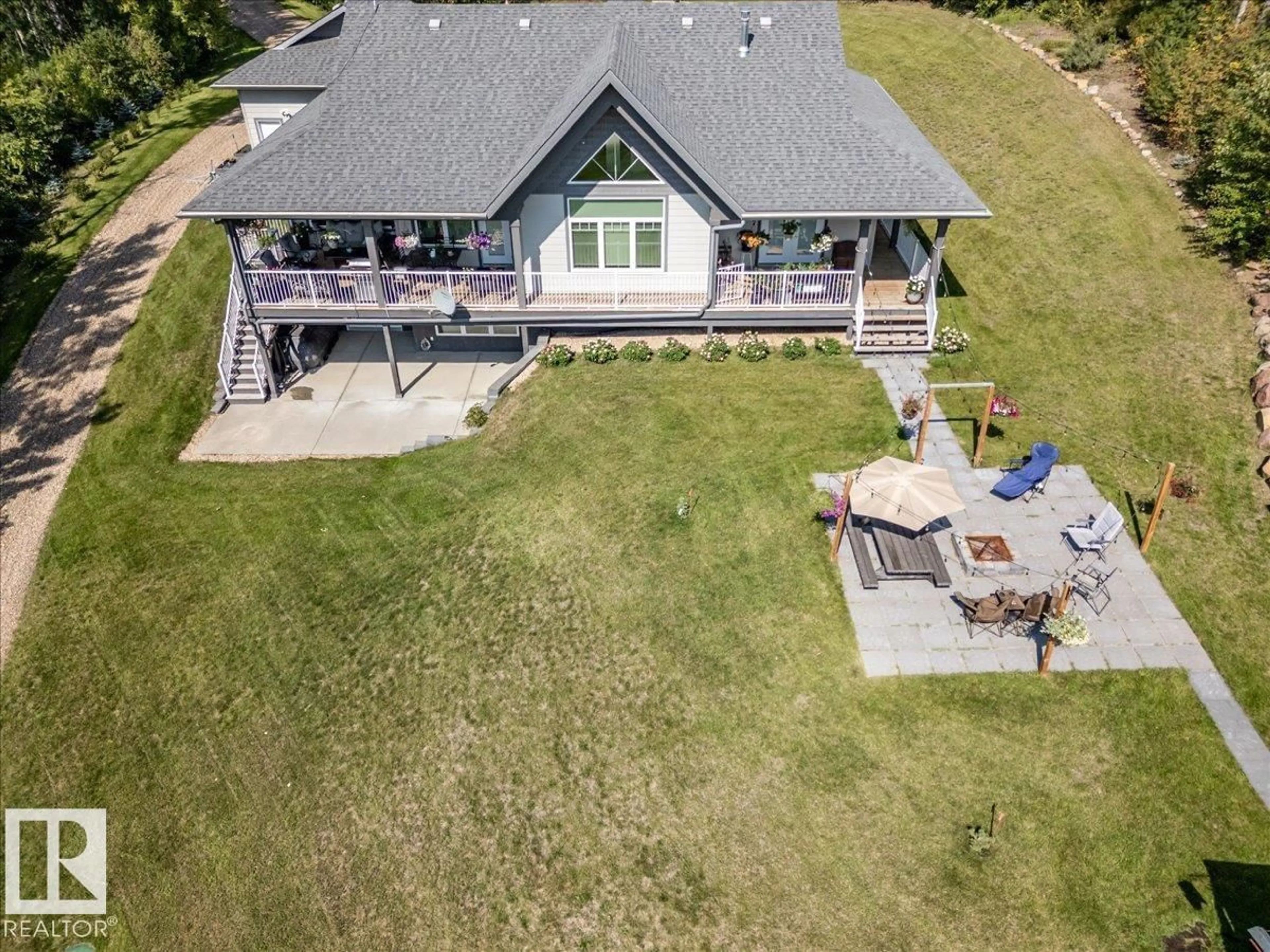 A pic from outside/outdoor area/front of a property/back of a property/a pic from drone, water/lake/river/ocean view for 622 - 160 2032 HWY, Rural Leduc County Alberta T0C2P0