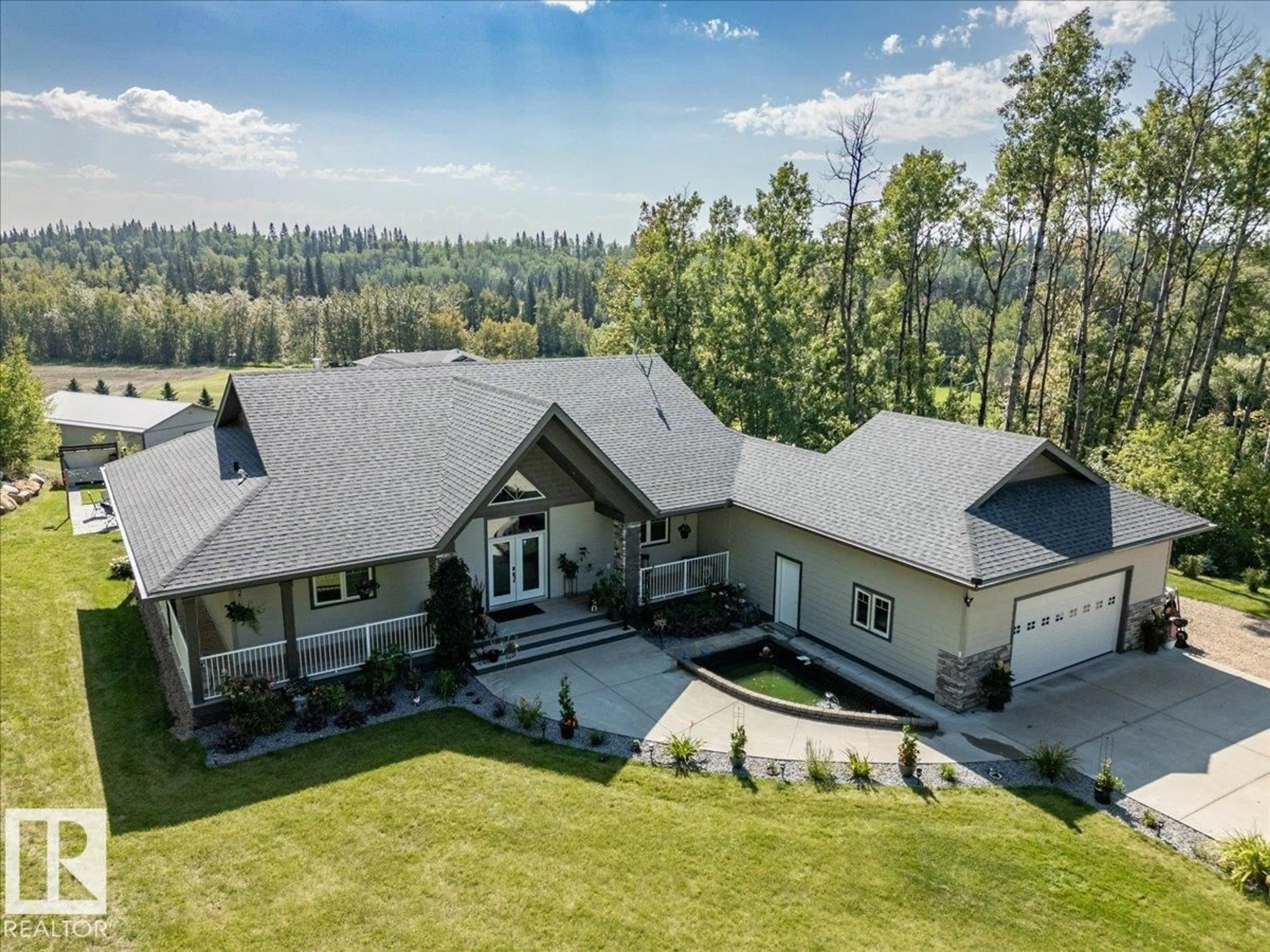 A pic from outside/outdoor area/front of a property/back of a property/a pic from drone, mountain view for 622 - 160 2032 HWY, Rural Leduc County Alberta T0C2P0