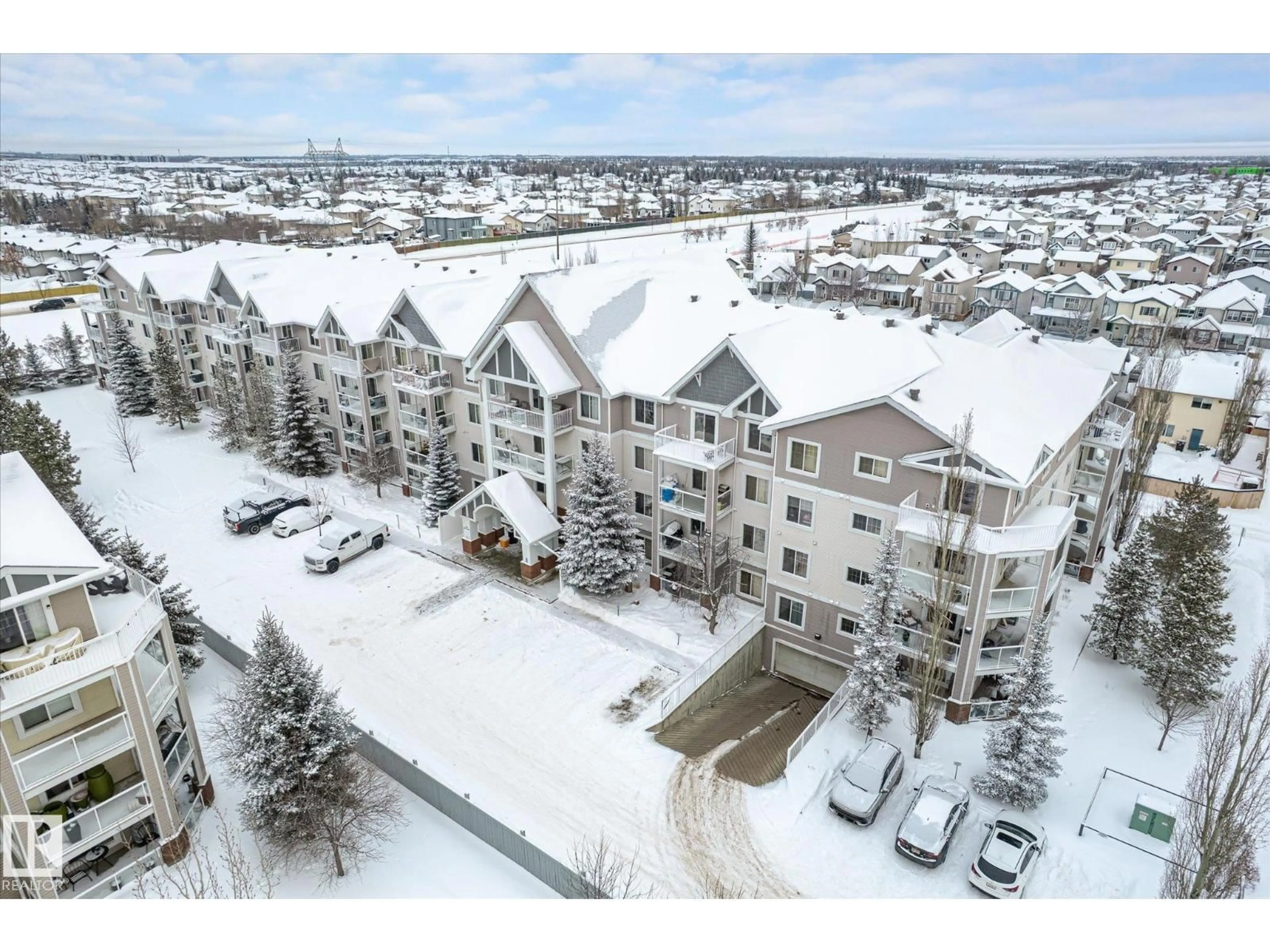A pic from outside/outdoor area/front of a property/back of a property/a pic from drone, mountain view for #205 - 13710 150 AV, Edmonton Alberta T6V0B2