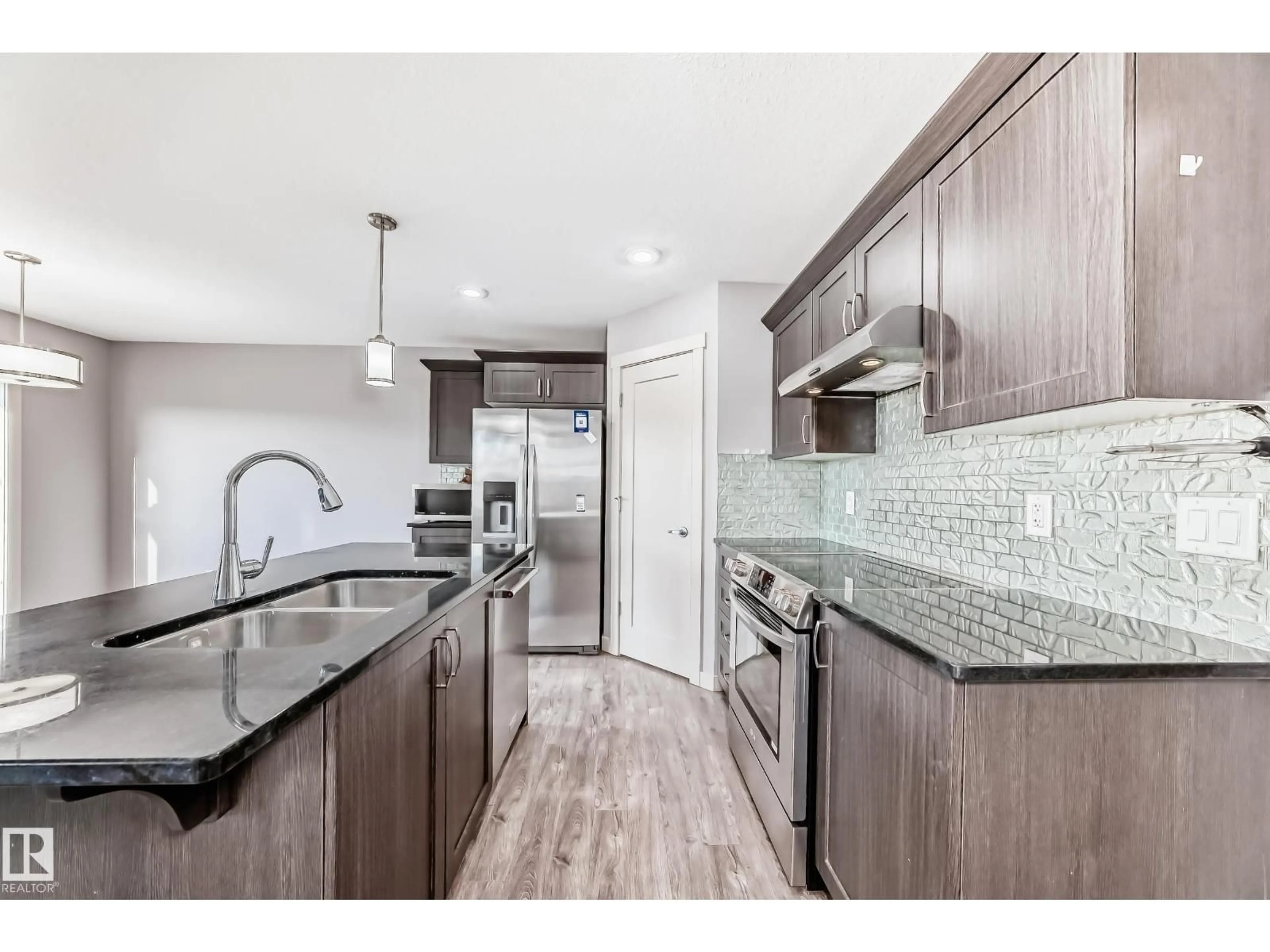 Open concept kitchen, unknown for NW - 1669 HAMMOND CR, Edmonton Alberta T6M0N3