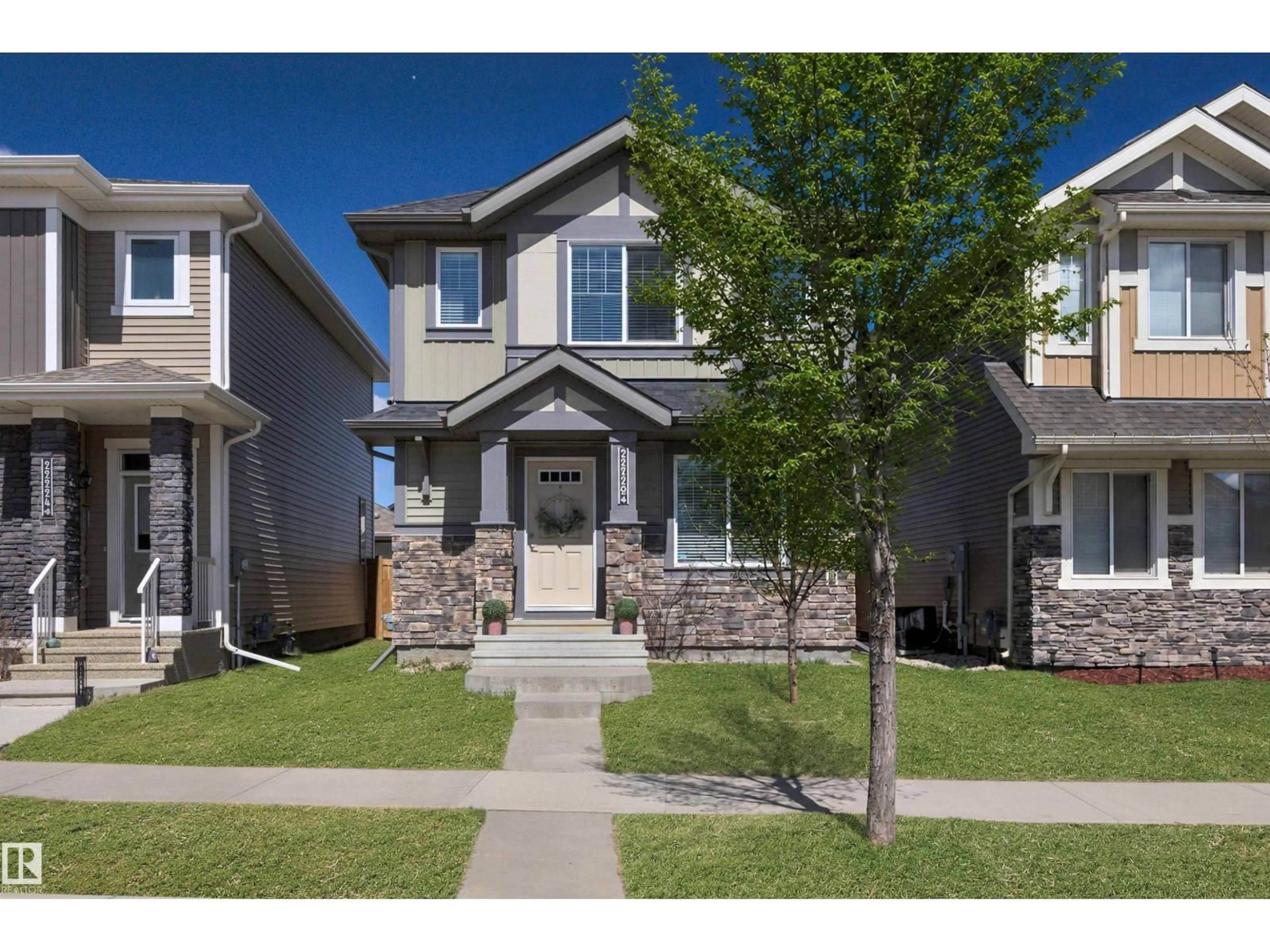 Home with vinyl exterior material, street for 22220 88 AV, Edmonton Alberta T5T7H2