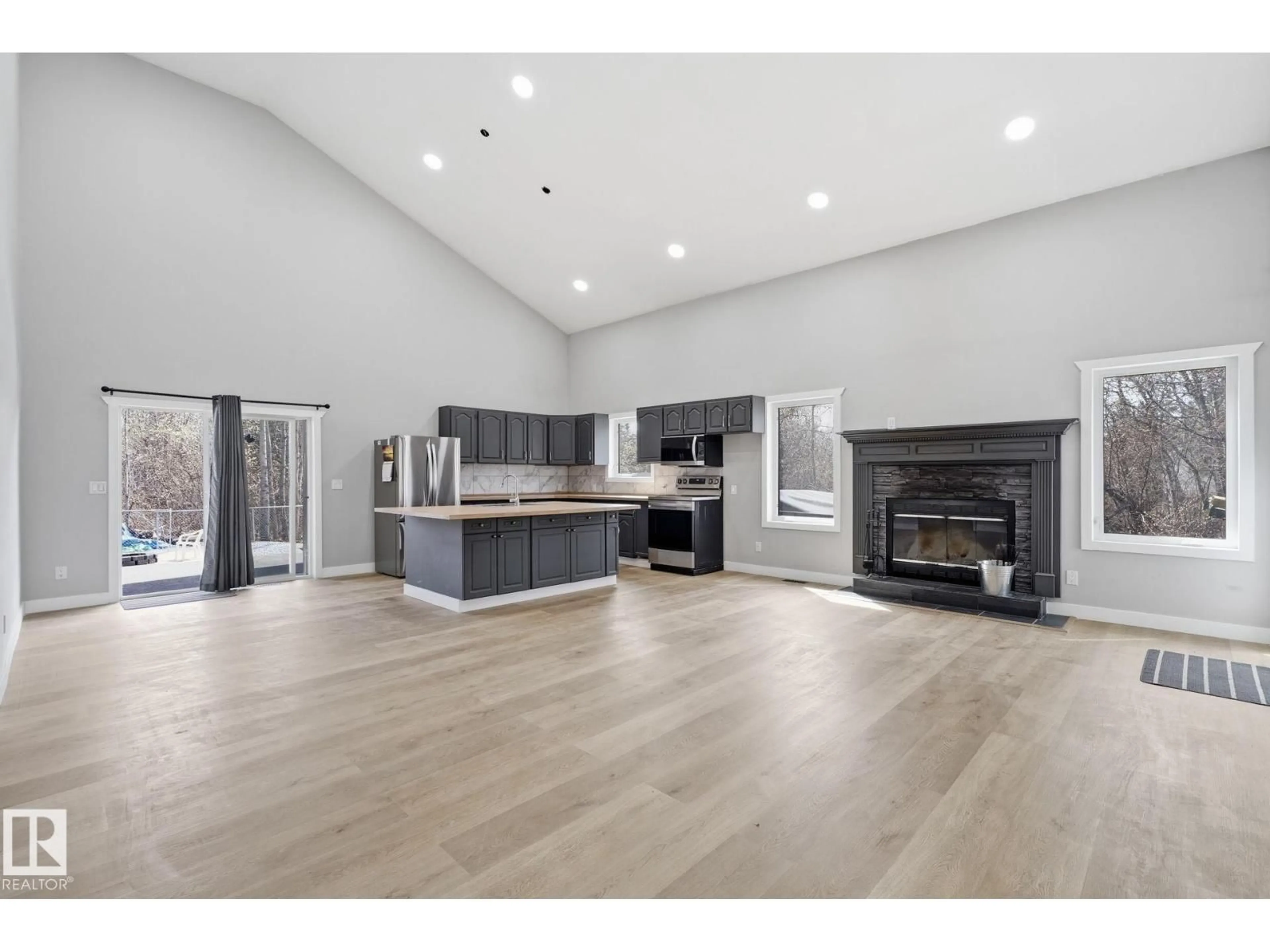 Open concept kitchen, wood/laminate floor for 213 2 AV, Rural Wetaskiwin County Alberta T0C1X0