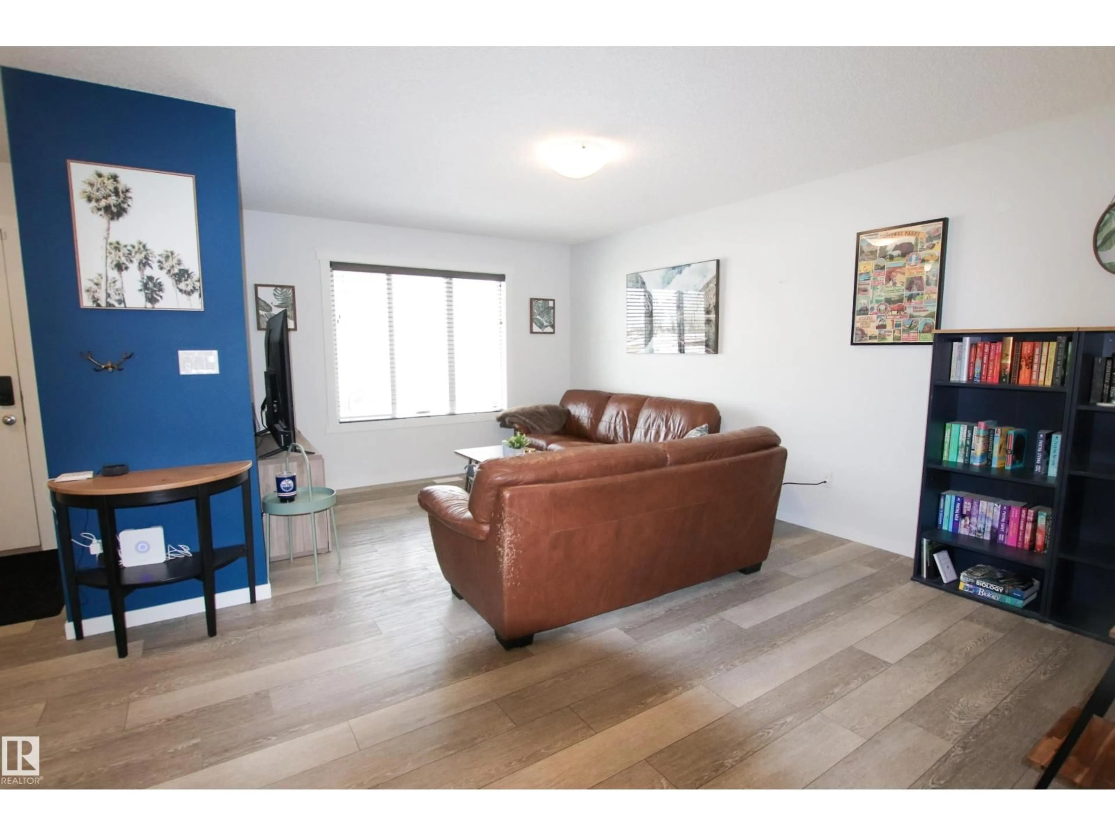Living room with furniture, wood/laminate floor for 2509 14 AV, Edmonton Alberta T6T2J6