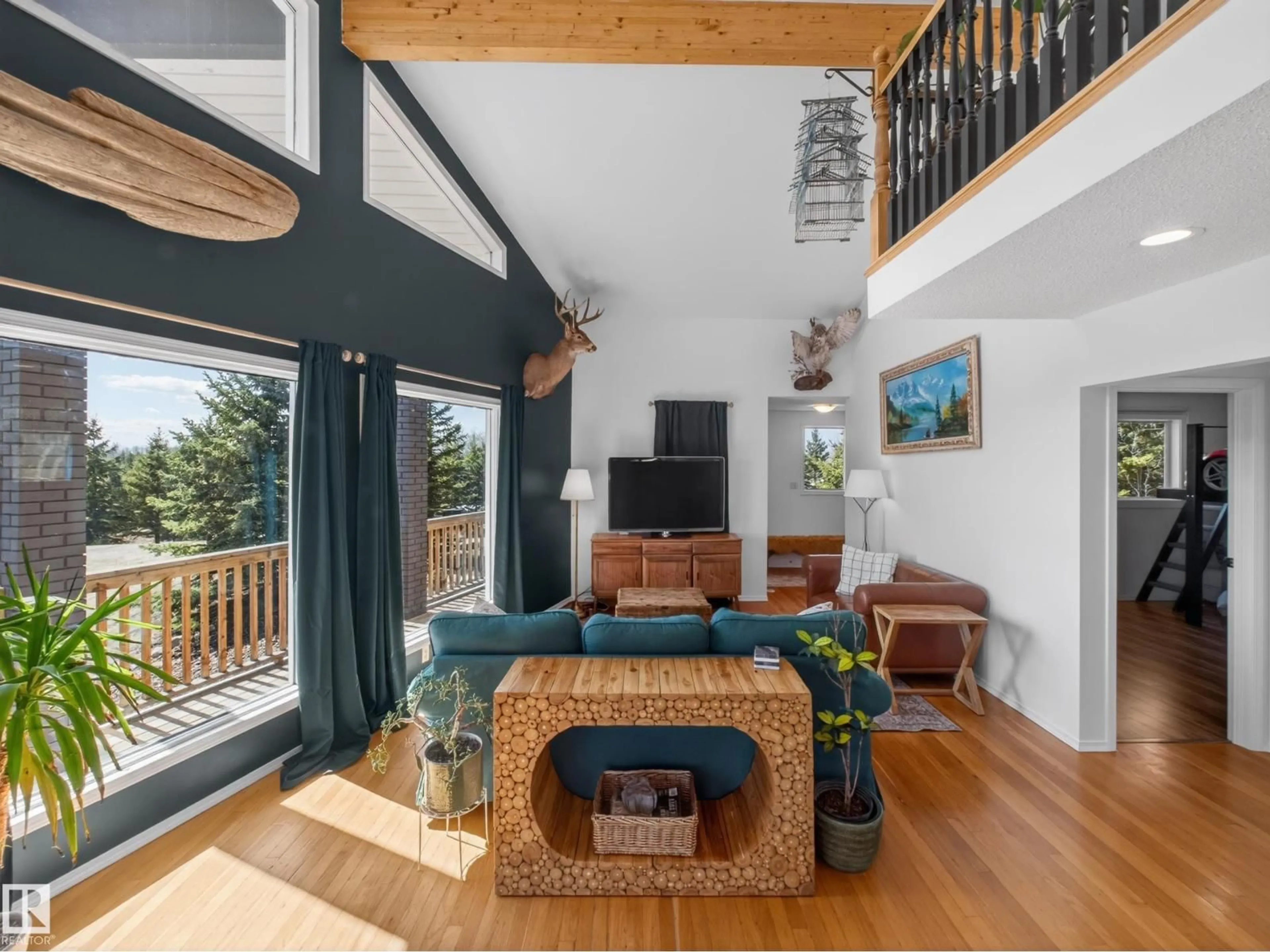 Living room with furniture, wood/laminate floor for 157 52411 RGE ROAD 214, Rural Strathcona County Alberta T8E2G8