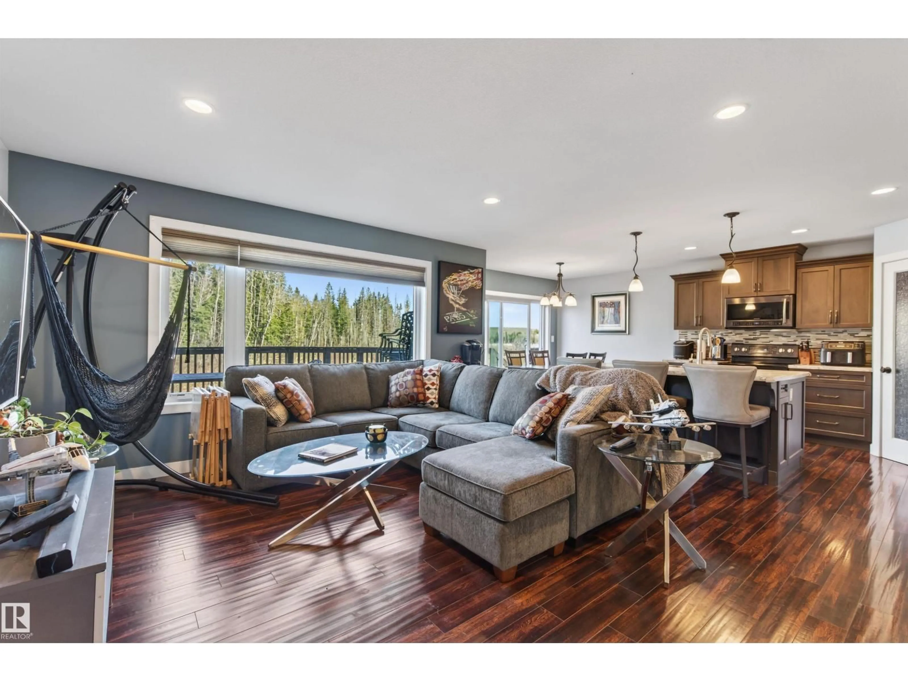 Living room with furniture, wood/laminate floor for 6603 TRI CITY WY, Cold Lake Alberta T9M0J2