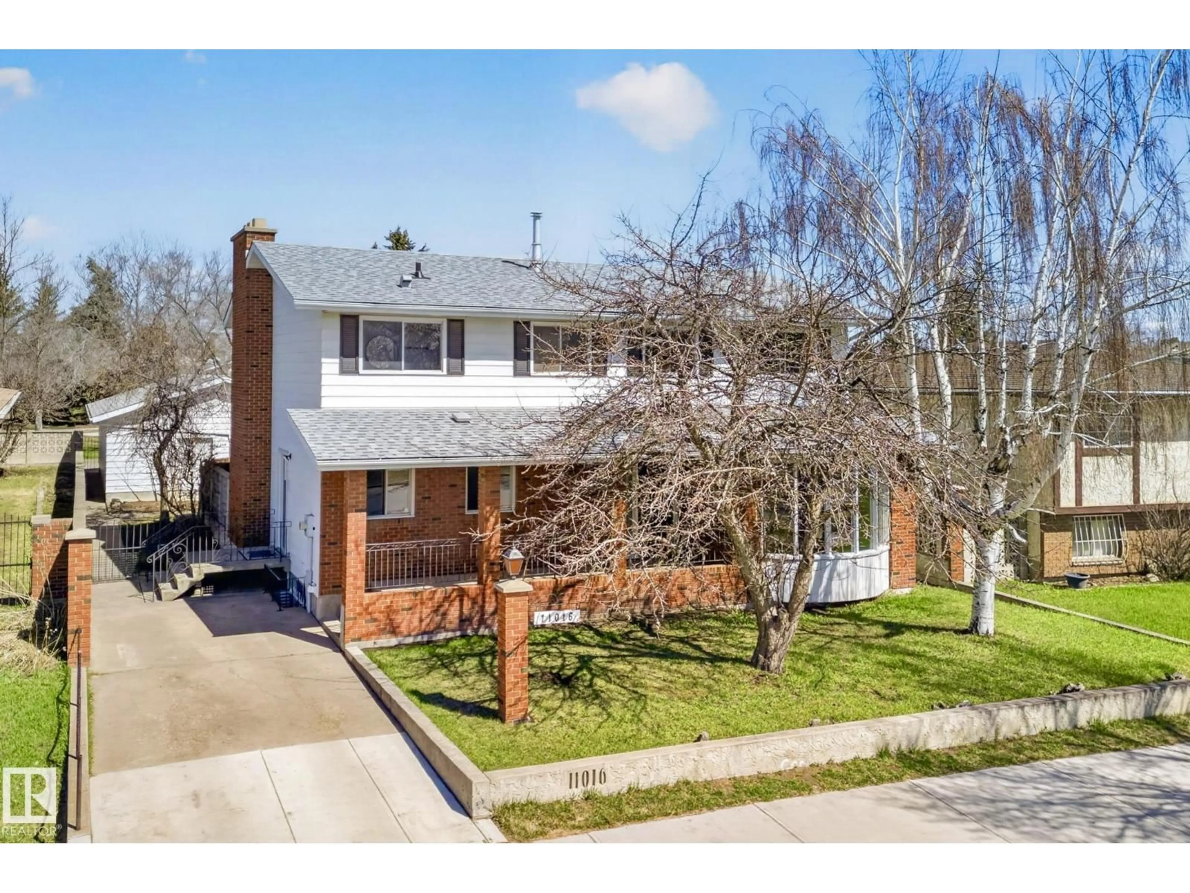 Home with brick exterior material, street for NW - 11016 171 AV, Edmonton Alberta T5X3J6