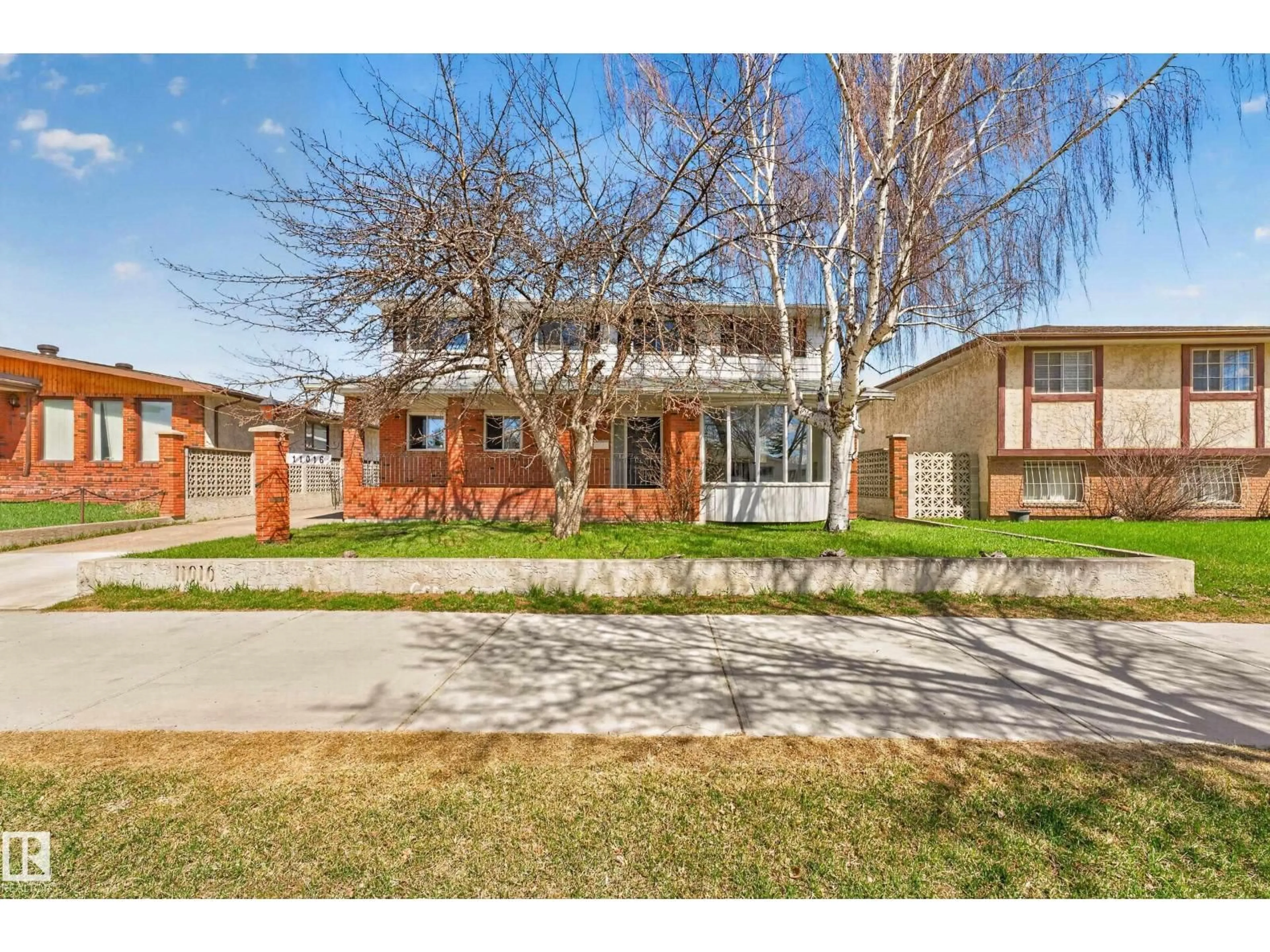 Home with brick exterior material, street for NW - 11016 171 AV, Edmonton Alberta T5X3J6