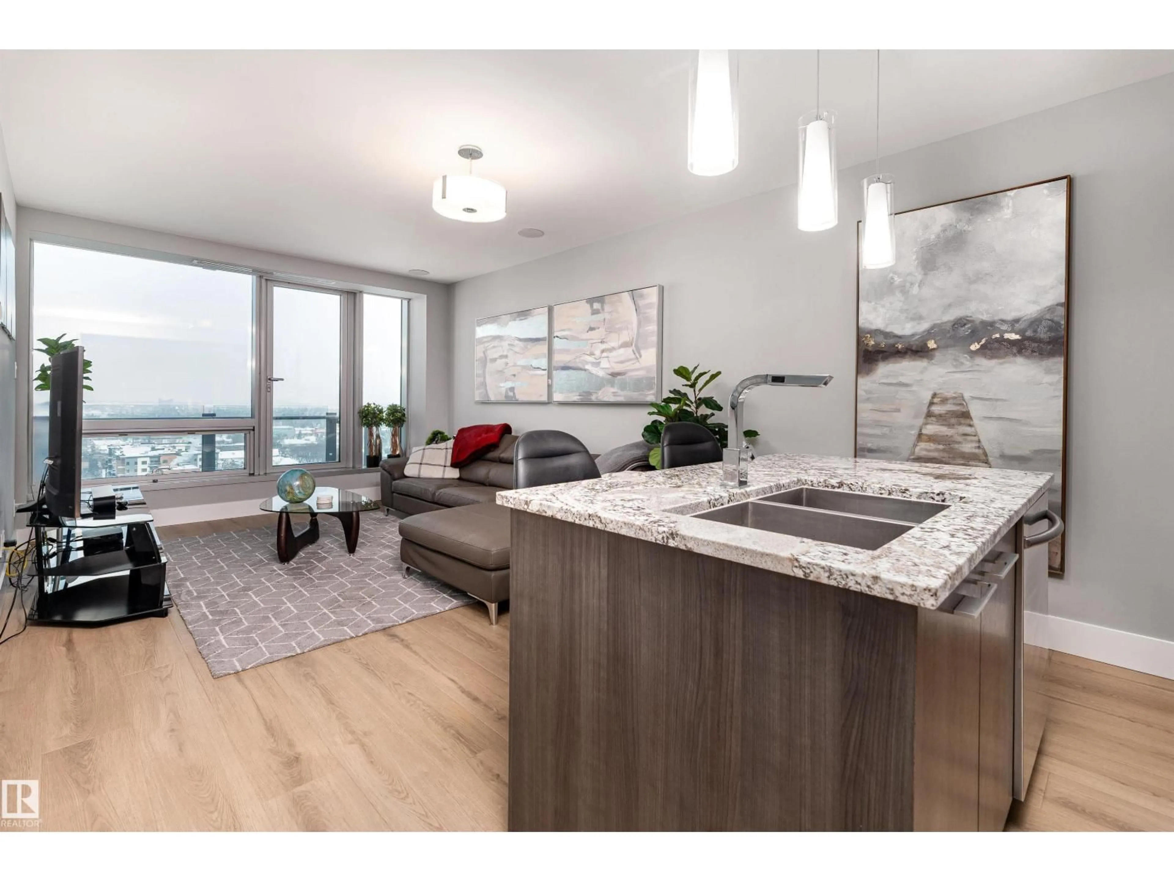 Open concept kitchen, wood/laminate floor for 1404 - 11969 JASPER AV, Edmonton Alberta T5K0P1