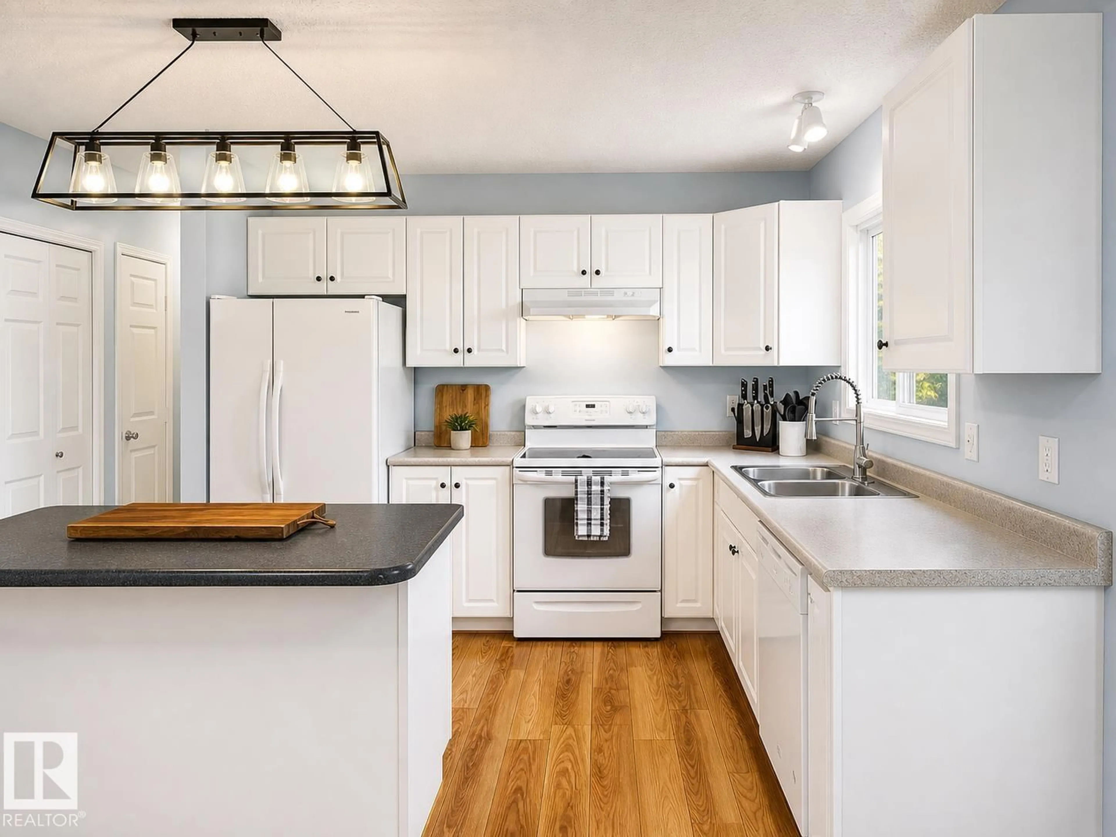 Open concept kitchen, wood/laminate floor for 614 19 ST, Cold Lake Alberta T9M1C6