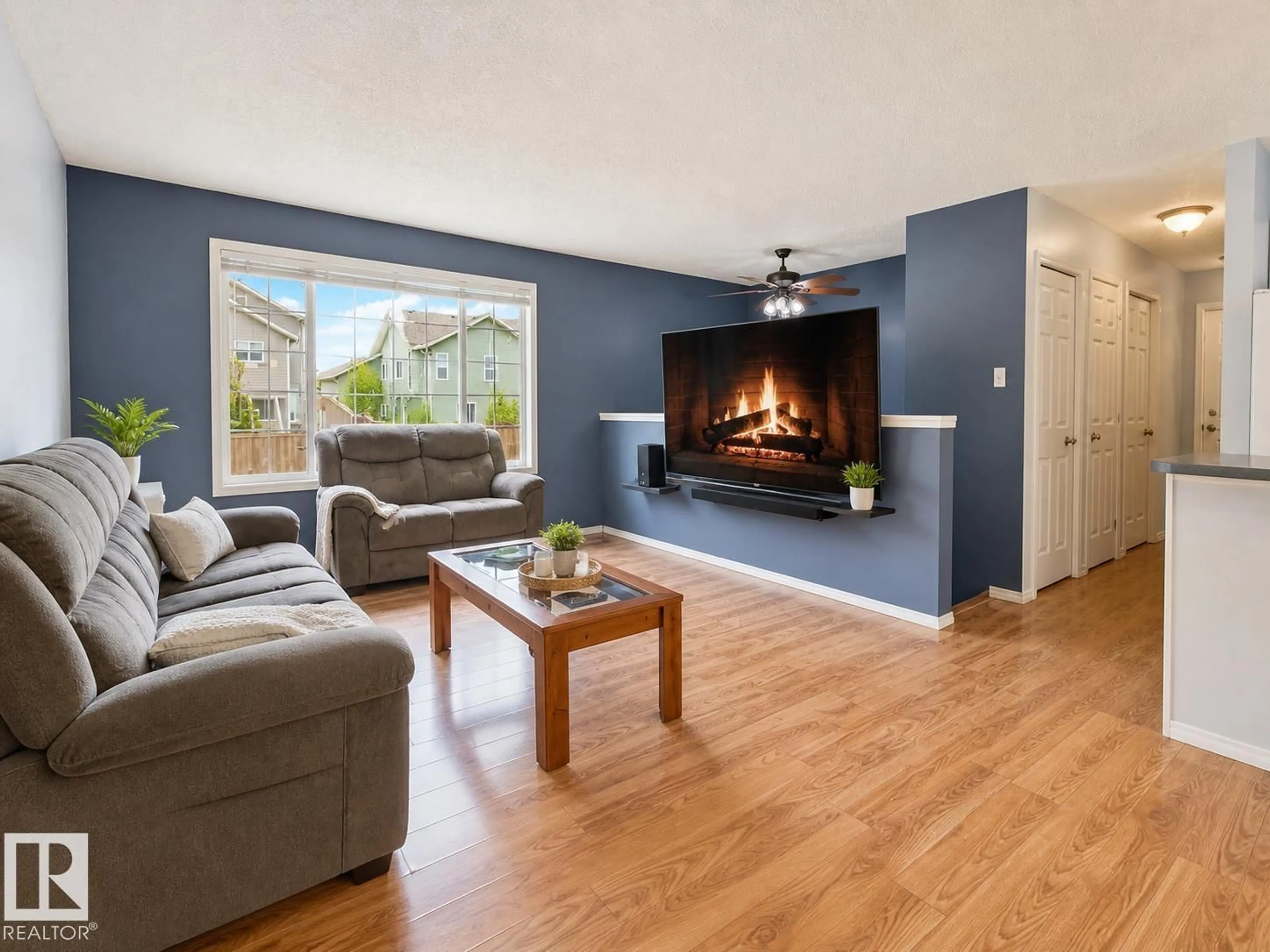 Living room with furniture, wood/laminate floor for 614 19 ST, Cold Lake Alberta T9M1C6