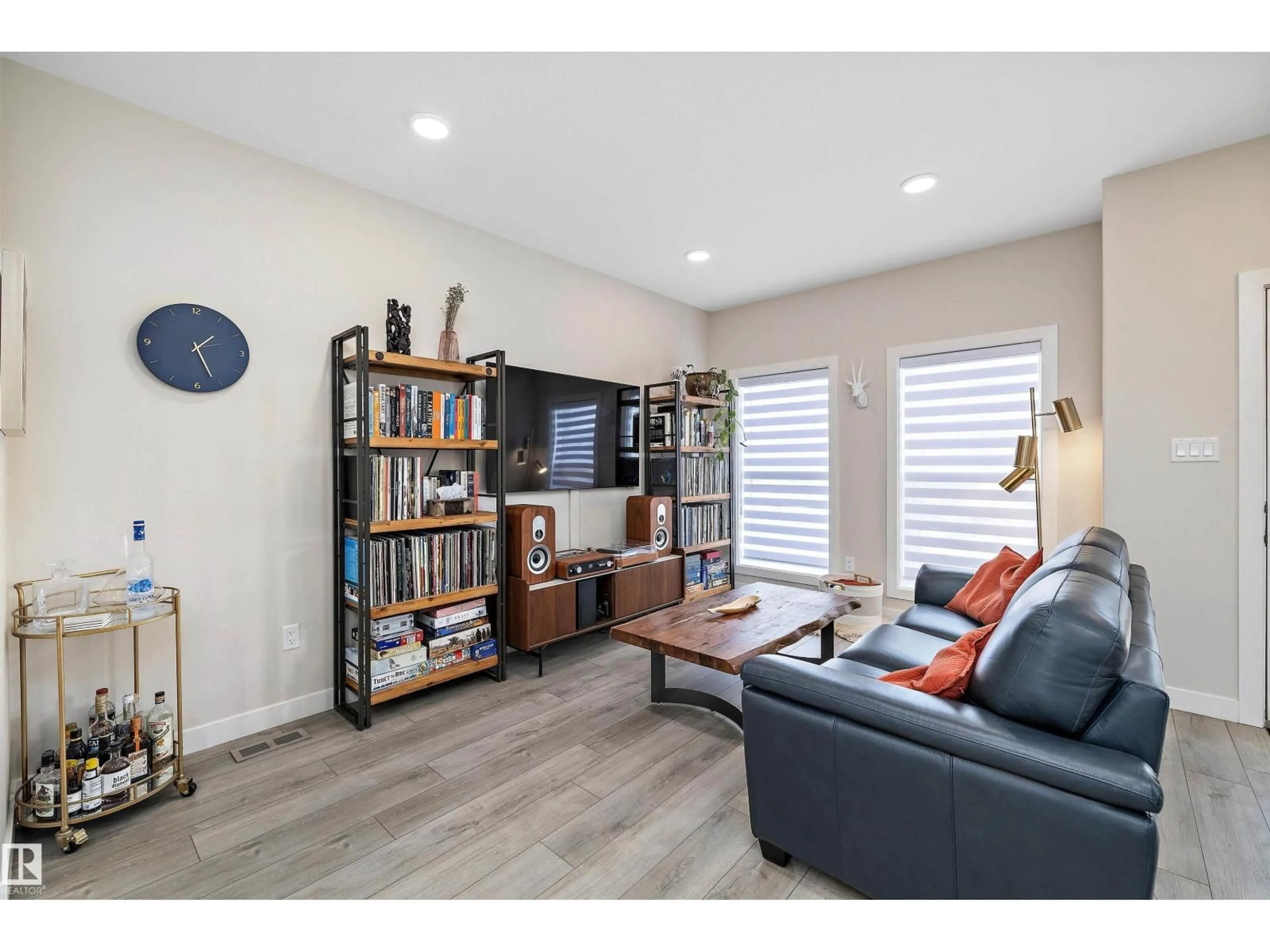 Living room with furniture, wood/laminate floor for 7817 YORKE RD, Edmonton Alberta T5G2R6
