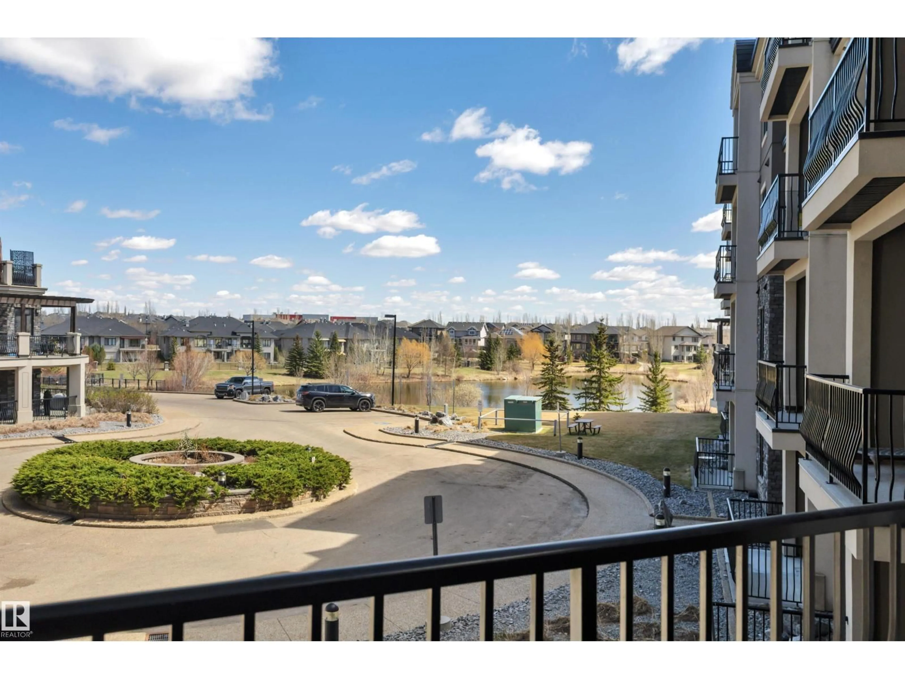Patio, city buildings view from balcony for 6079 - 243 MAYNARD WY, Edmonton Alberta T6R0S5
