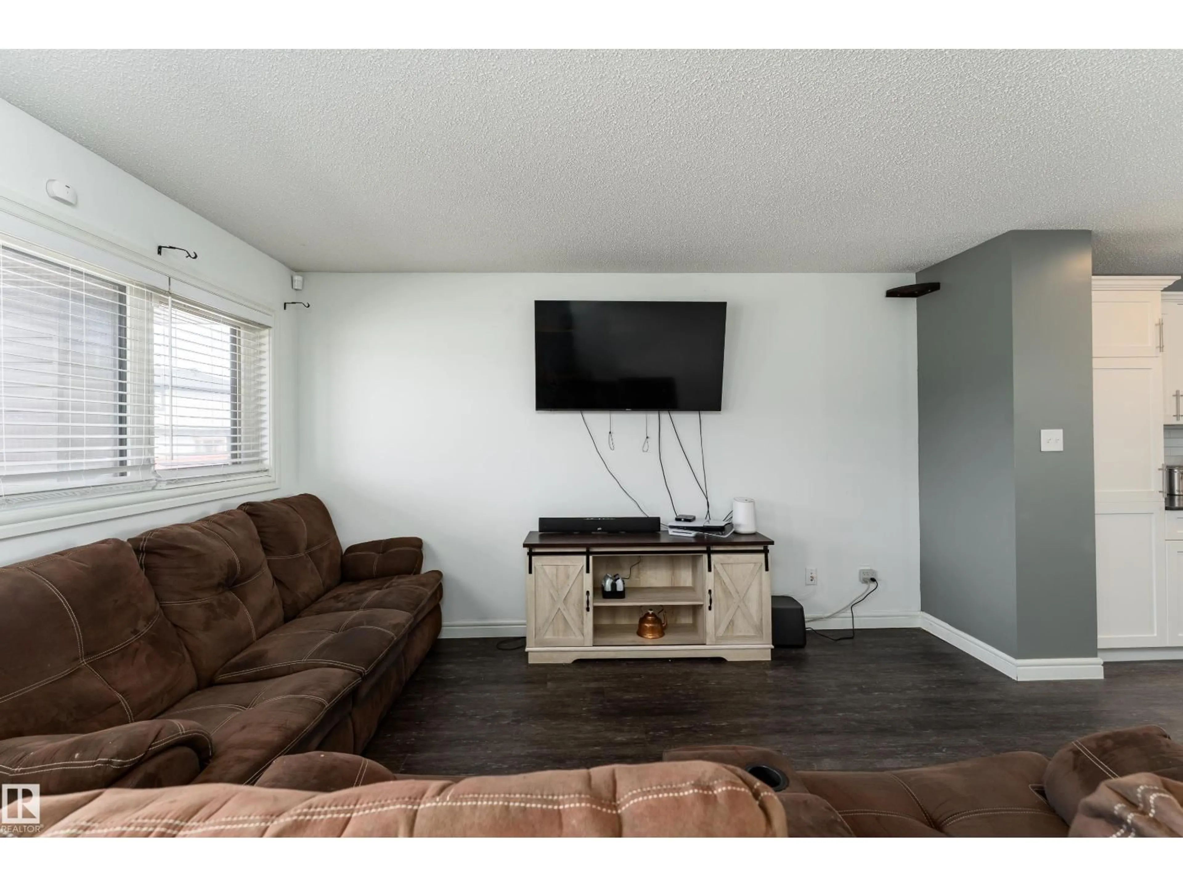 Living room with furniture, wood/laminate floor for 7 TRIBUTE CM, Spruce Grove Alberta T7X0W5