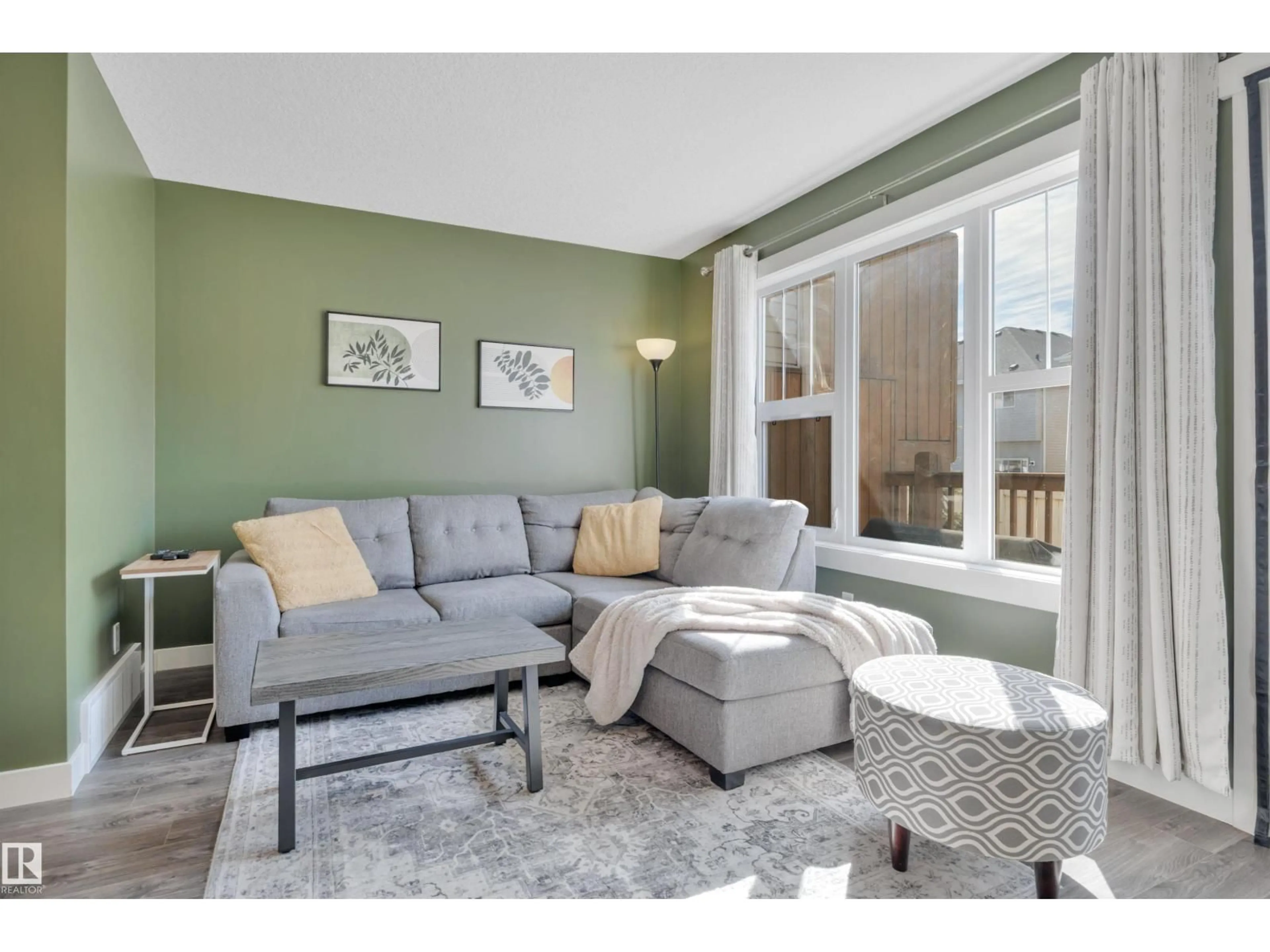 Living room with furniture, wood/laminate floor for #309 - 401 SOUTHFORK DR, Leduc Alberta T9E0X1