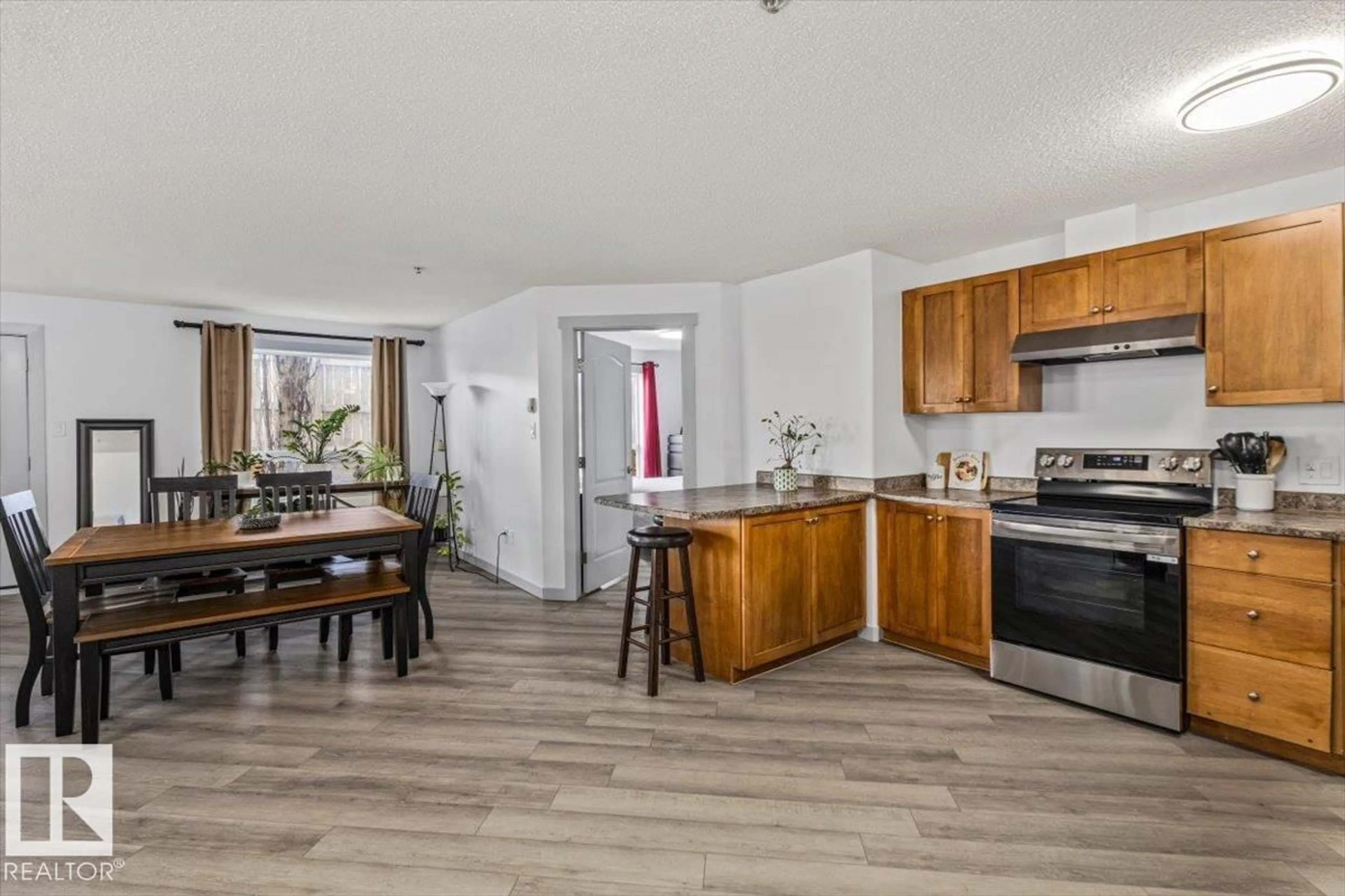Open concept kitchen, wood/laminate floor for 1110 CLAREVIEW STATION DR, Edmonton Alberta T5Y0E6