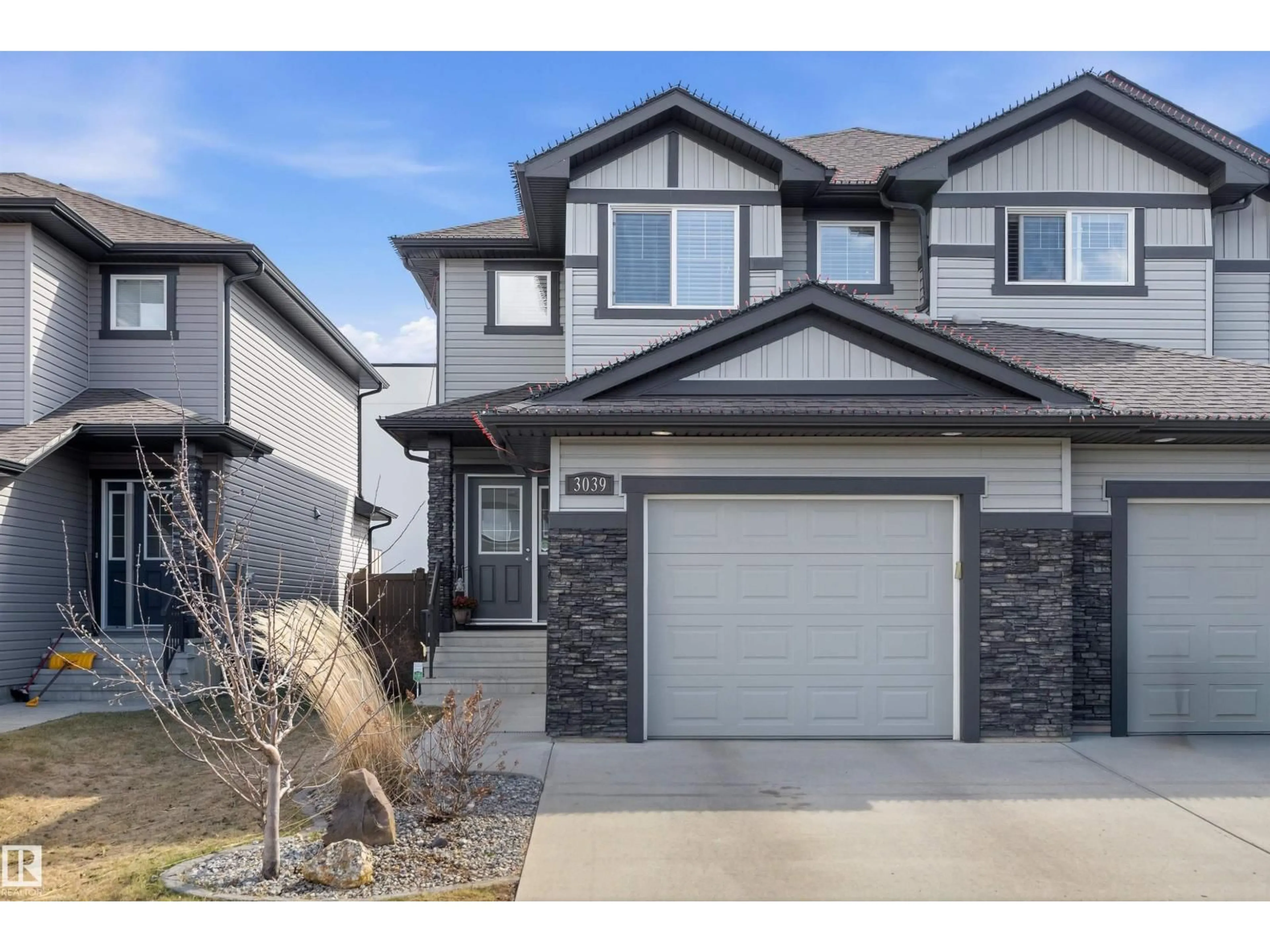 Home with vinyl exterior material, street for 3039 HARVEY CR, Edmonton Alberta T6M0N2