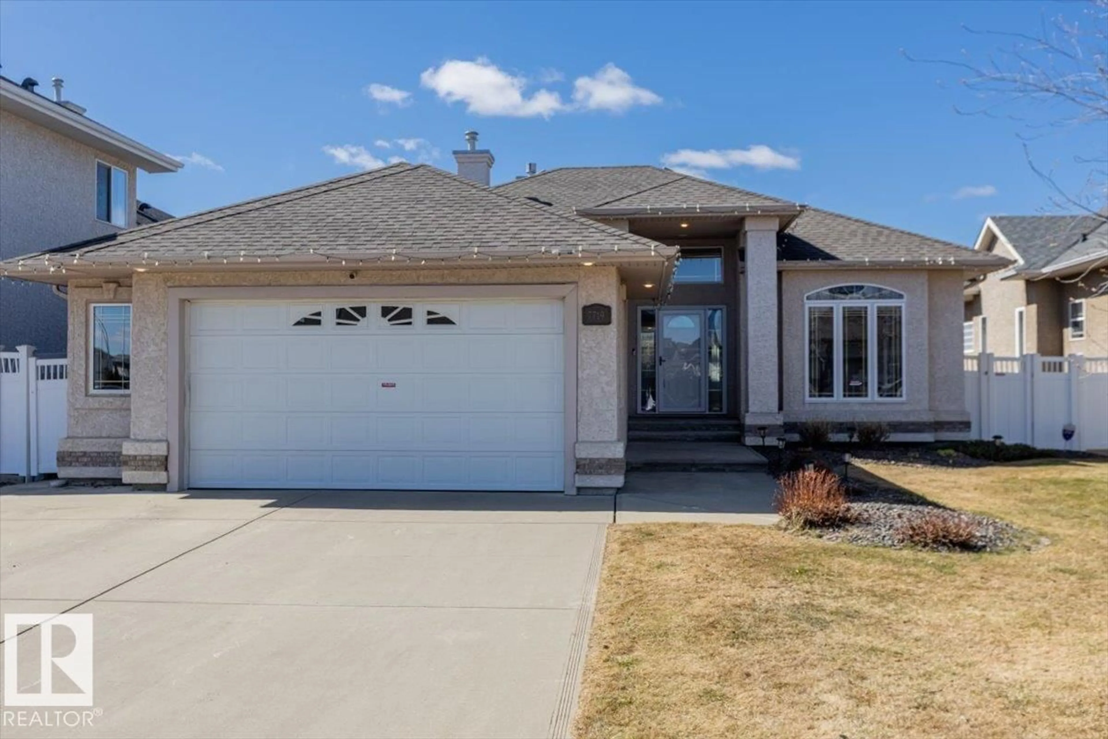 Home with vinyl exterior material, street for 7719 166 AV, Edmonton Alberta T5Z3V8