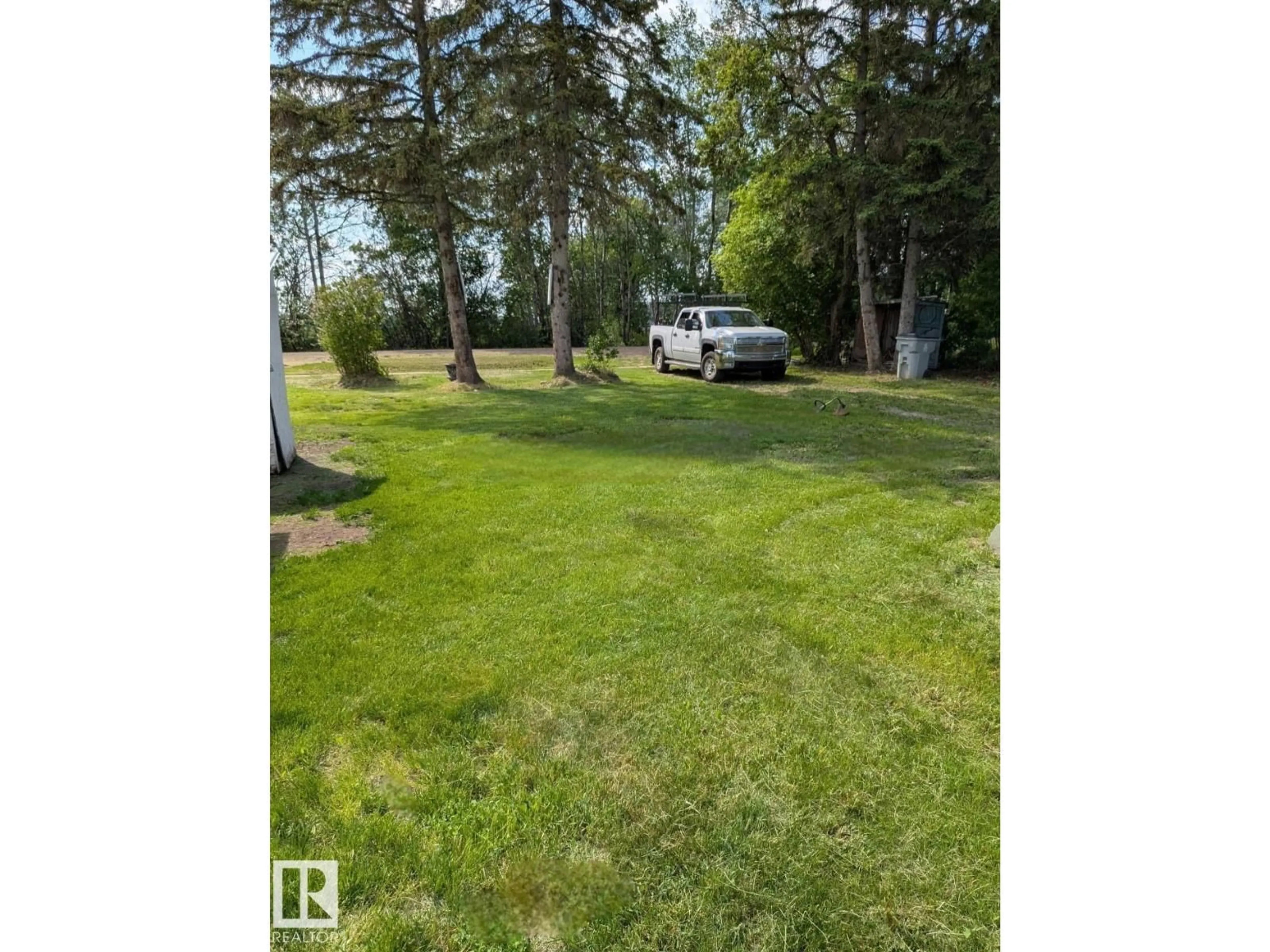 A pic from outside/outdoor area/front of a property/back of a property/a pic from drone, water/lake/river/ocean view for 4805 50, Pibroch Alberta T7P2P6
