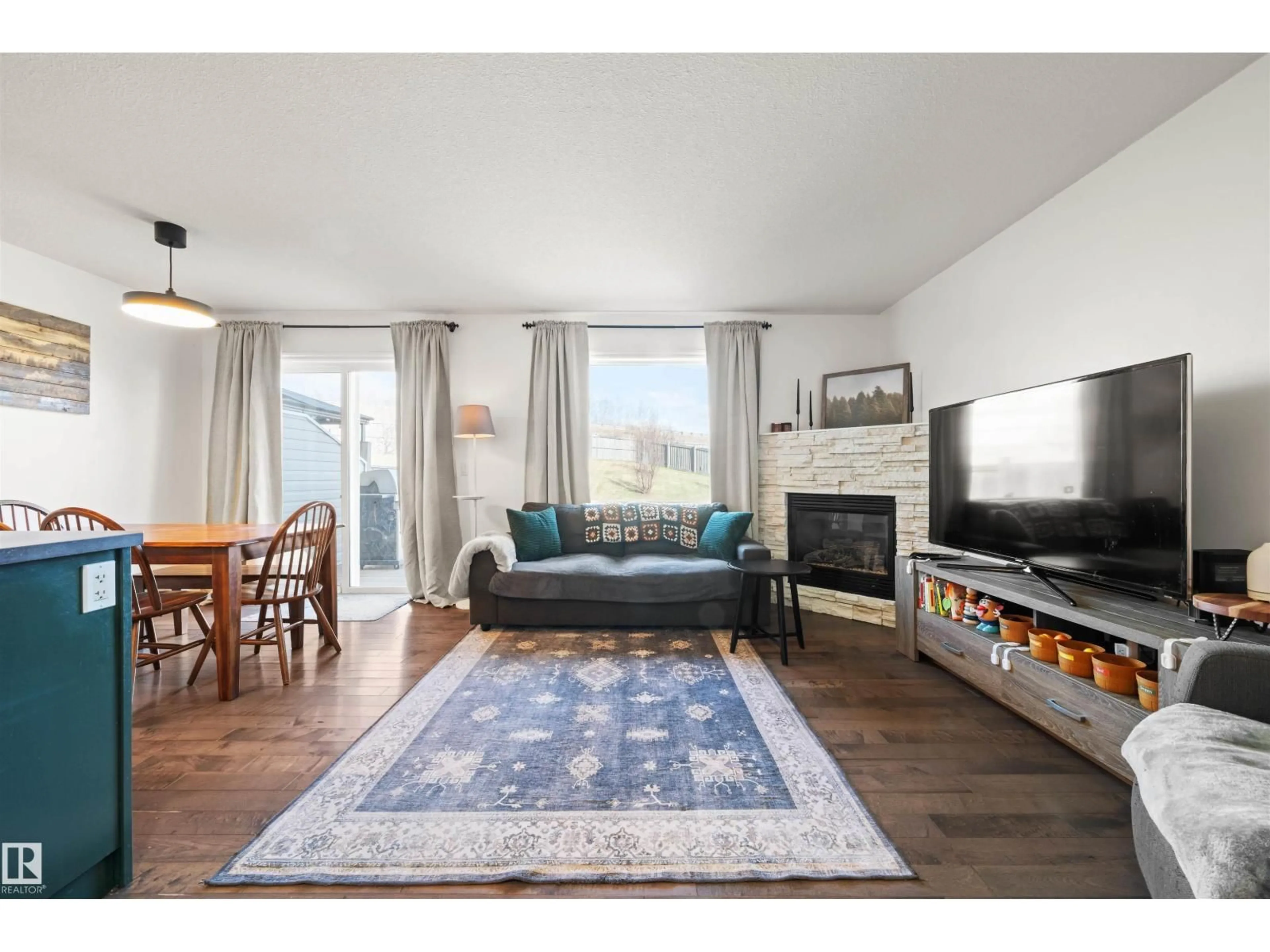 Living room with furniture, wood/laminate floor for 21324 46 AV, Edmonton Alberta T6M0H1