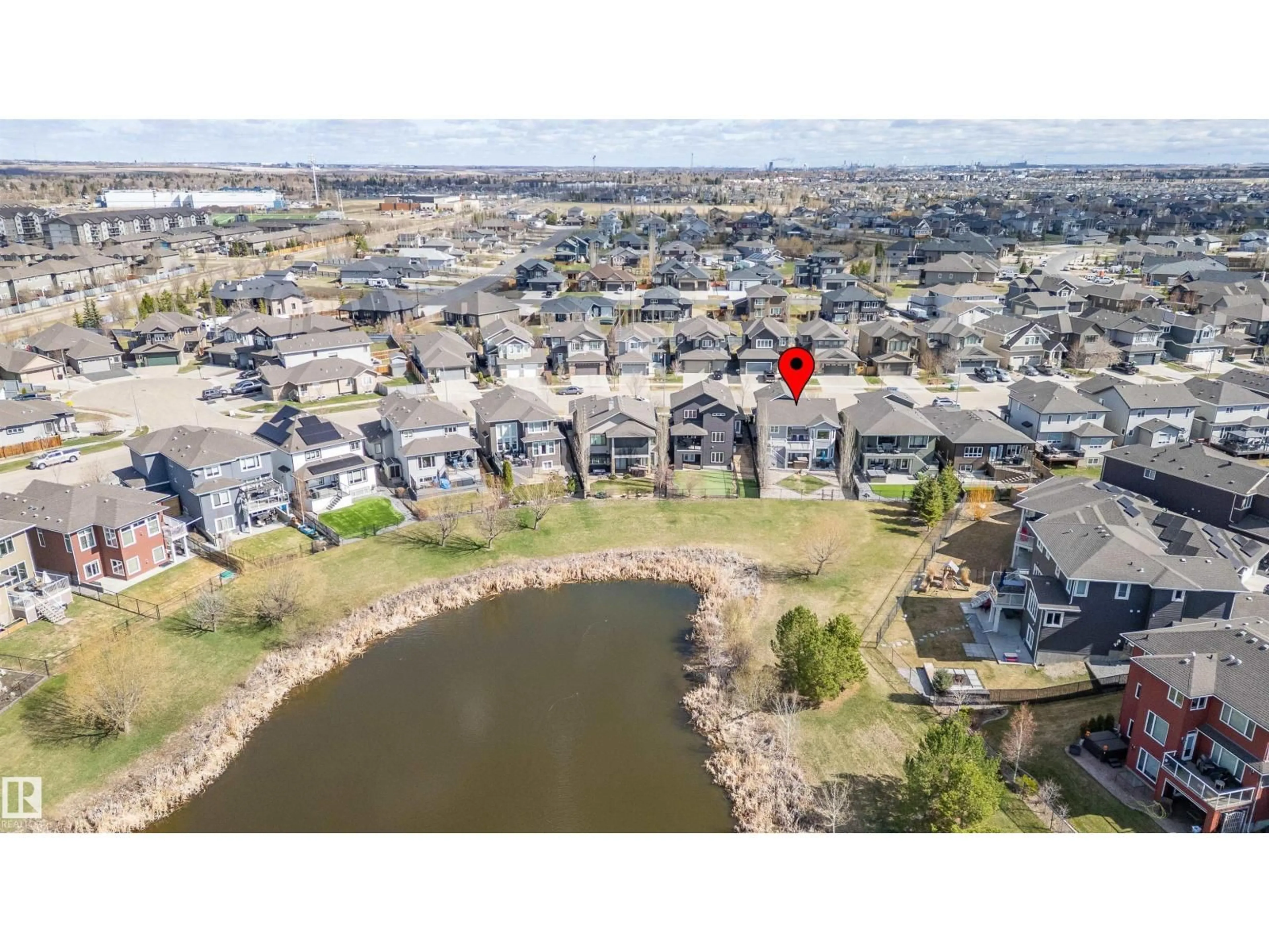 A pic from outside/outdoor area/front of a property/back of a property/a pic from drone, water/lake/river/ocean view for 437 MEADOWVIEW DR, Fort Saskatchewan Alberta T8L0N9