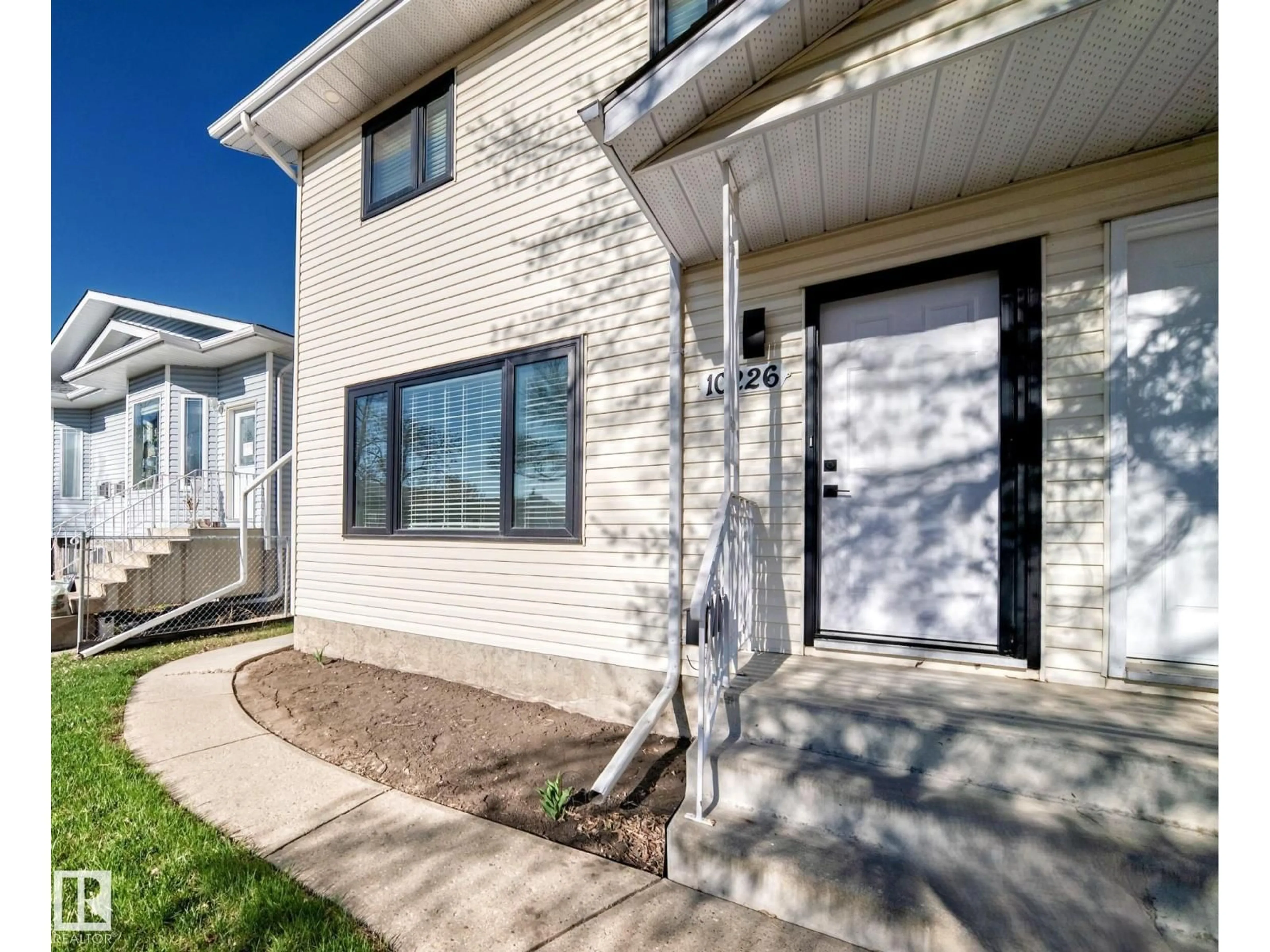 Home with vinyl exterior material, street for 10226 152 ST, Edmonton Alberta T5P1Y2