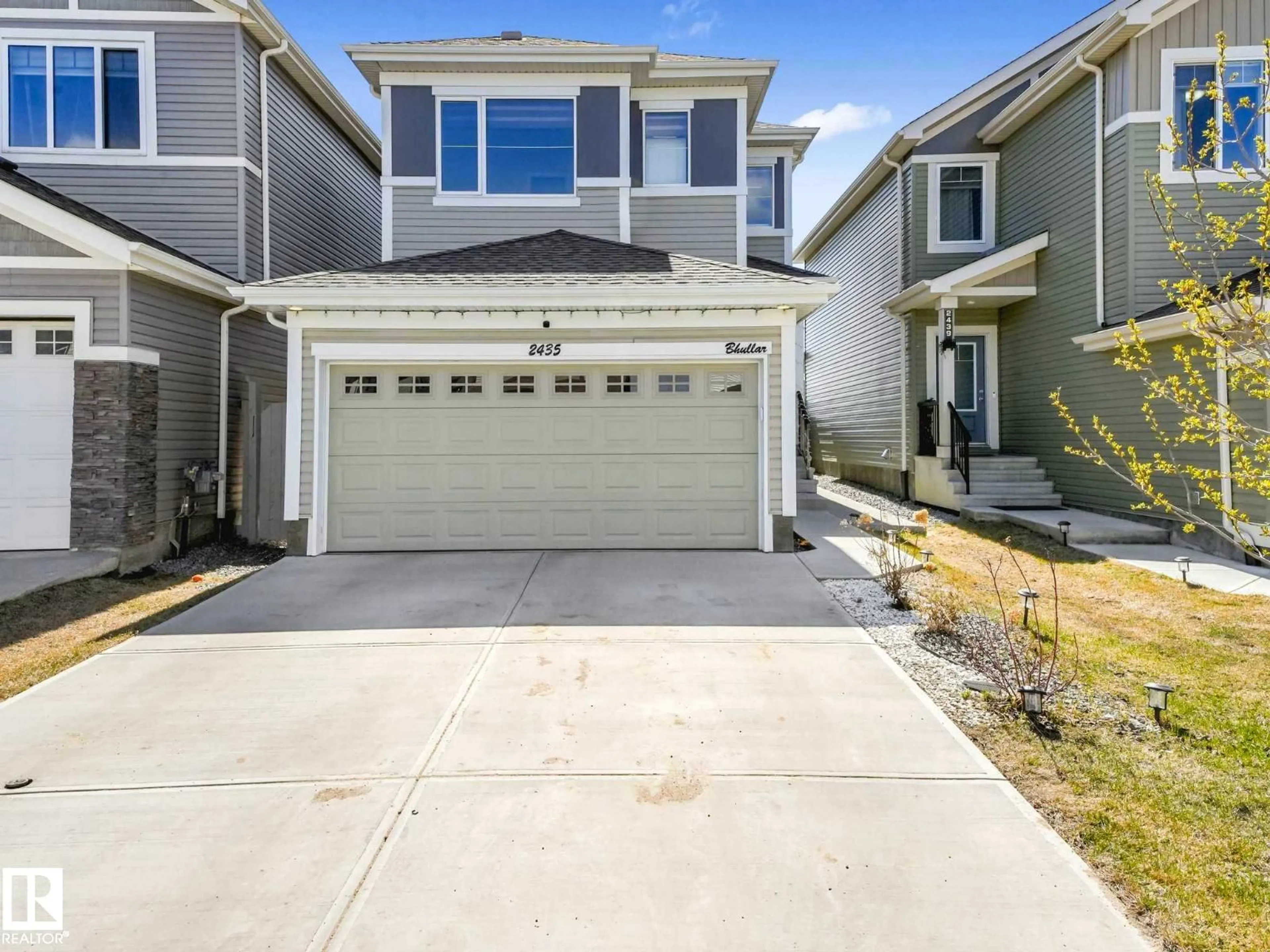 Home with vinyl exterior material, street for 2435 12 AV, Edmonton Alberta T6T2M6