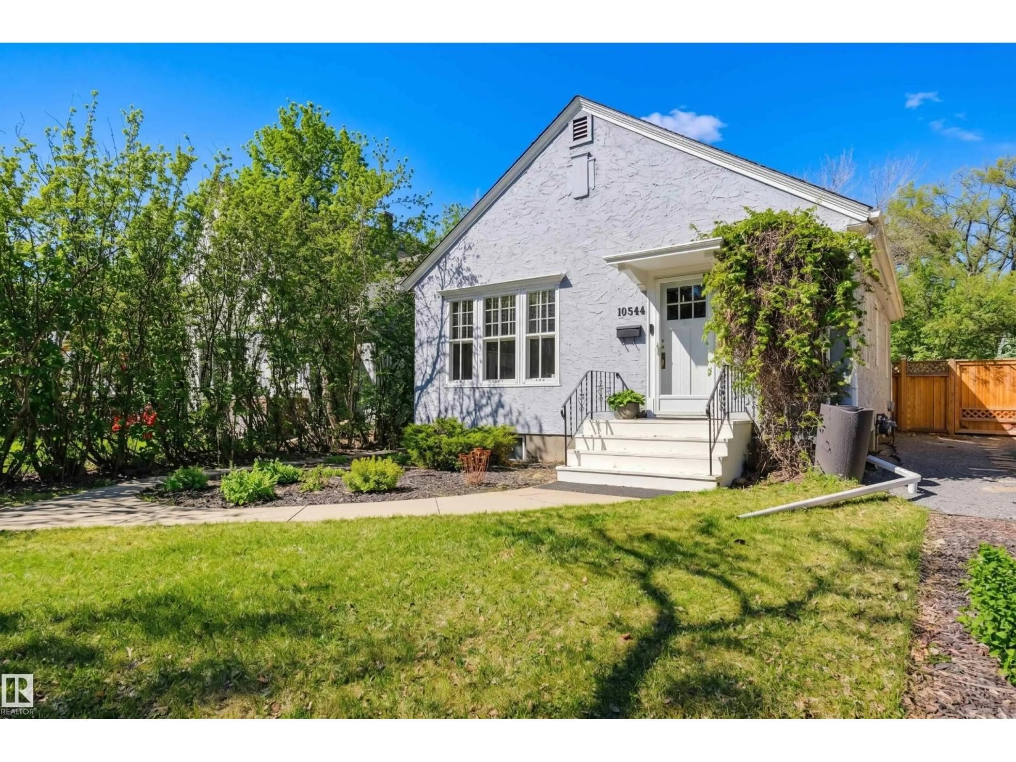 Home with vinyl exterior material, street for NW - 10544 127 ST, Edmonton Alberta T5N1V9