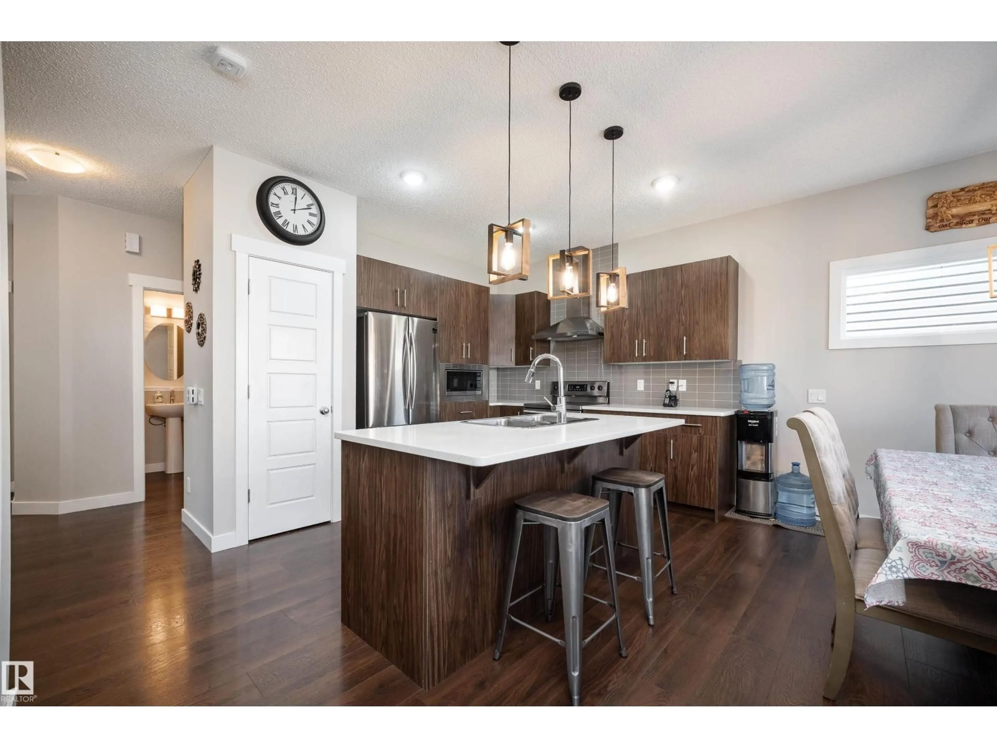 Open concept kitchen, wood/laminate floor for 3222 CHERNOWSKI WY, Edmonton Alberta T6W4G4