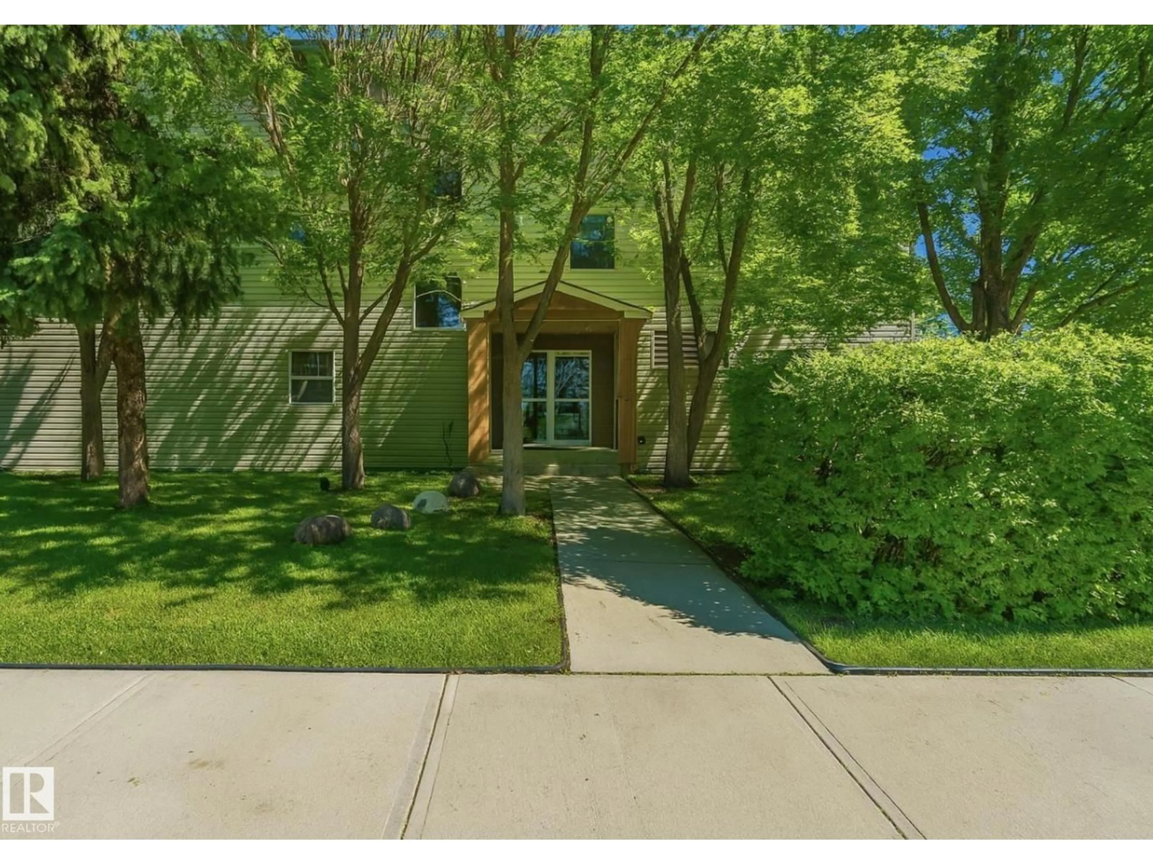 A pic from outside/outdoor area/front of a property/back of a property/a pic from drone, street for #103 - 12110 119 AVE NW, Edmonton Alberta T5L5G9