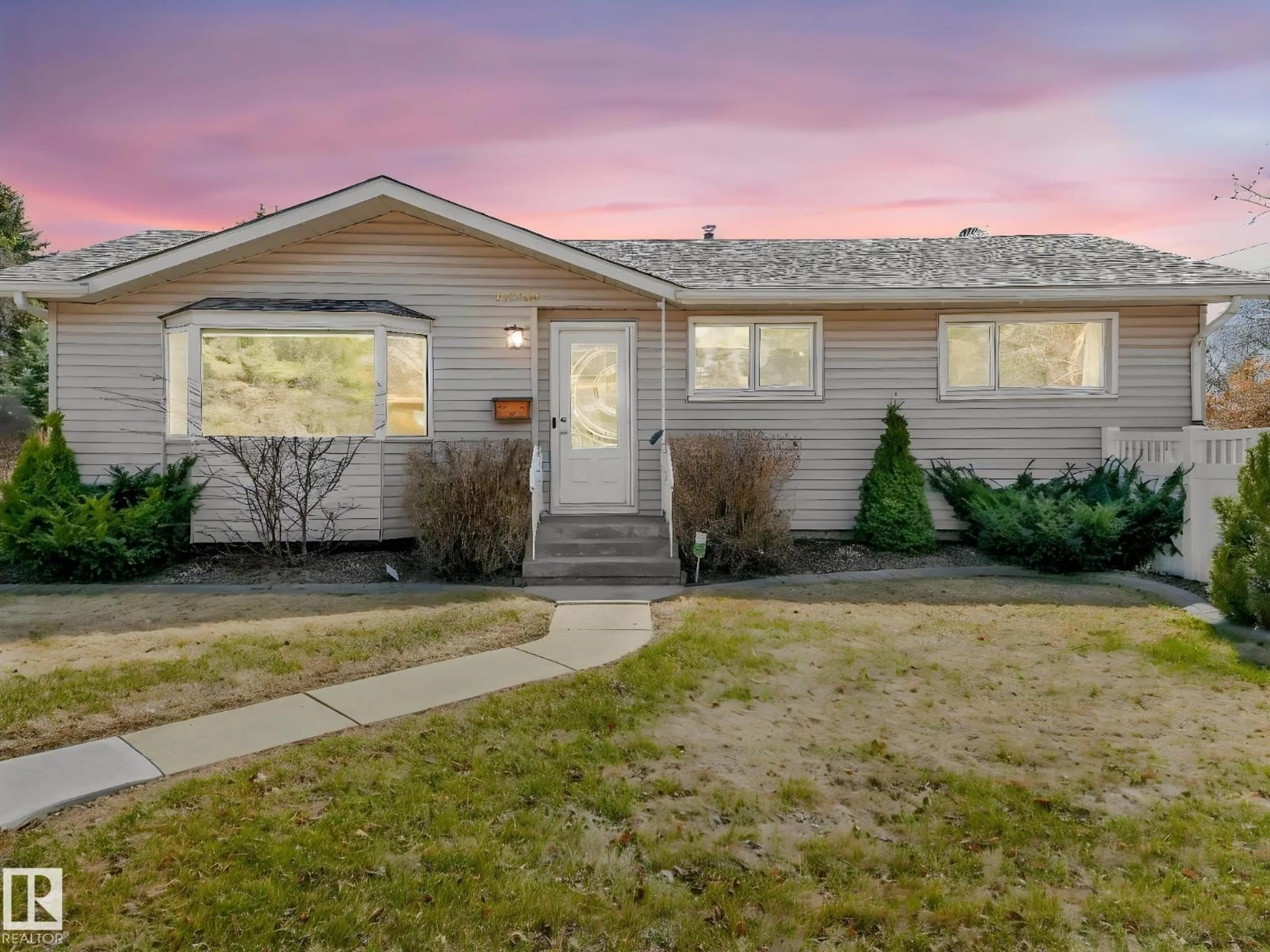 Home with vinyl exterior material, street for 12303 131 AV, Edmonton Alberta T5L3M9