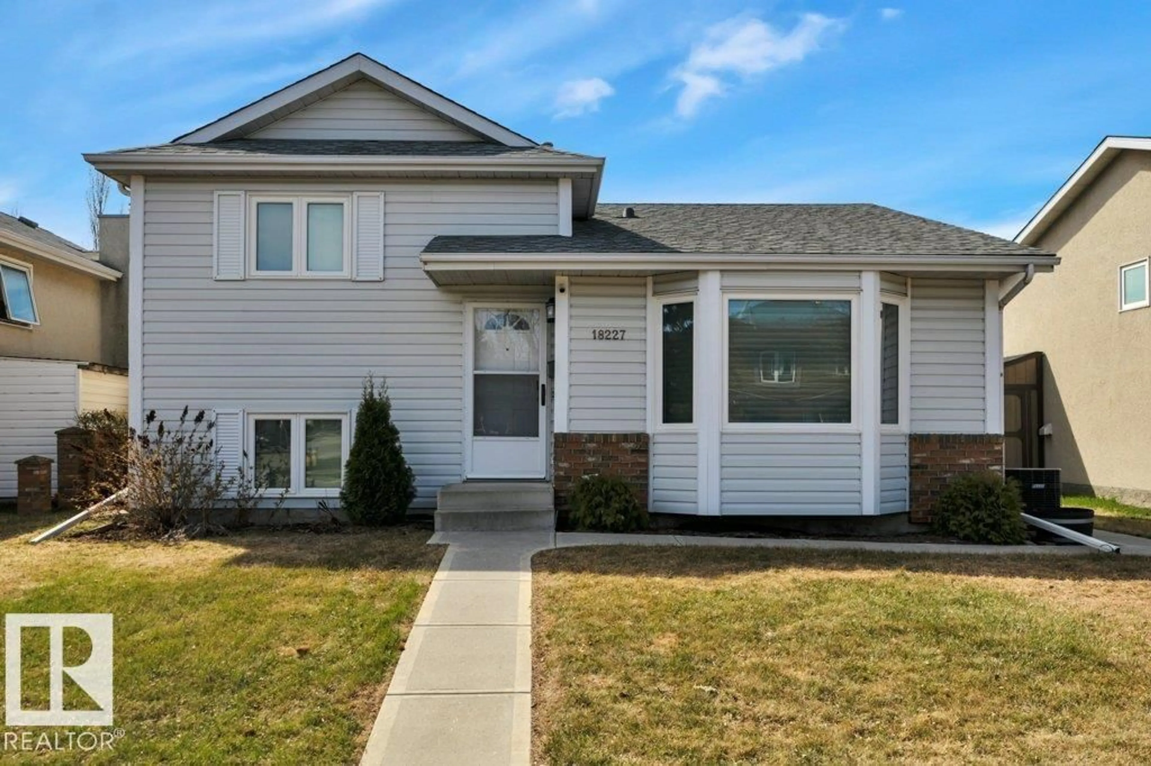 Home with vinyl exterior material, street for 18227 76 AV, Edmonton Alberta T5T4R2