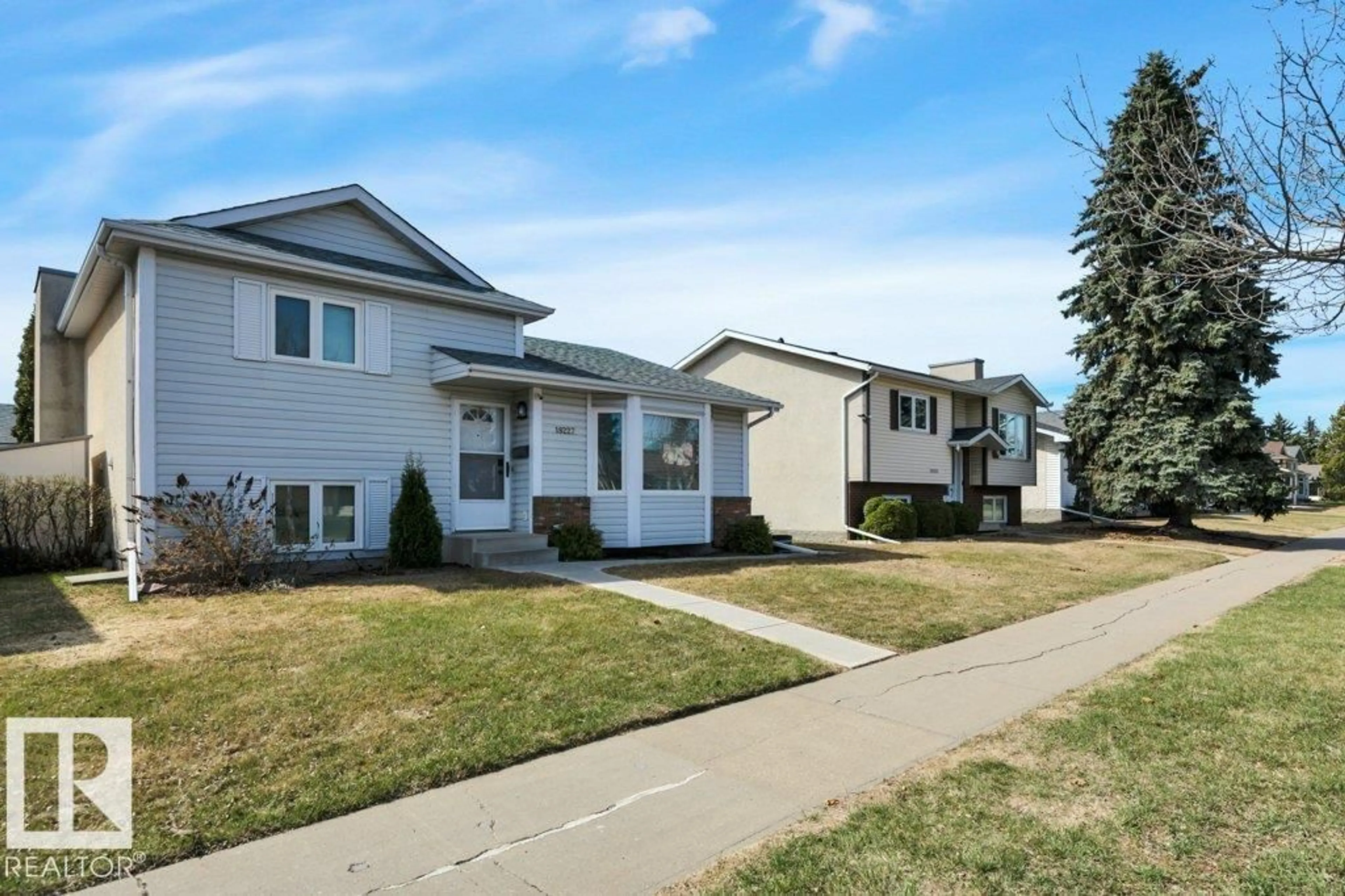 Home with vinyl exterior material, street for 18227 76 AV, Edmonton Alberta T5T4R2