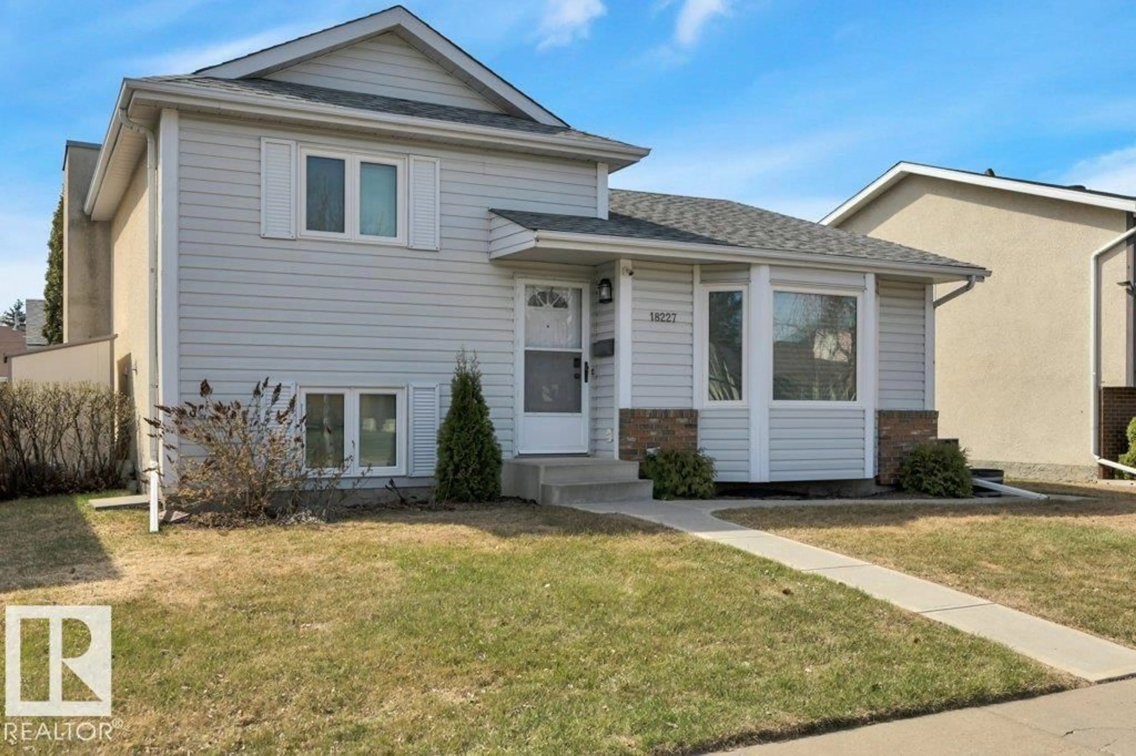 Home with vinyl exterior material, street for 18227 76 AV, Edmonton Alberta T5T4R2