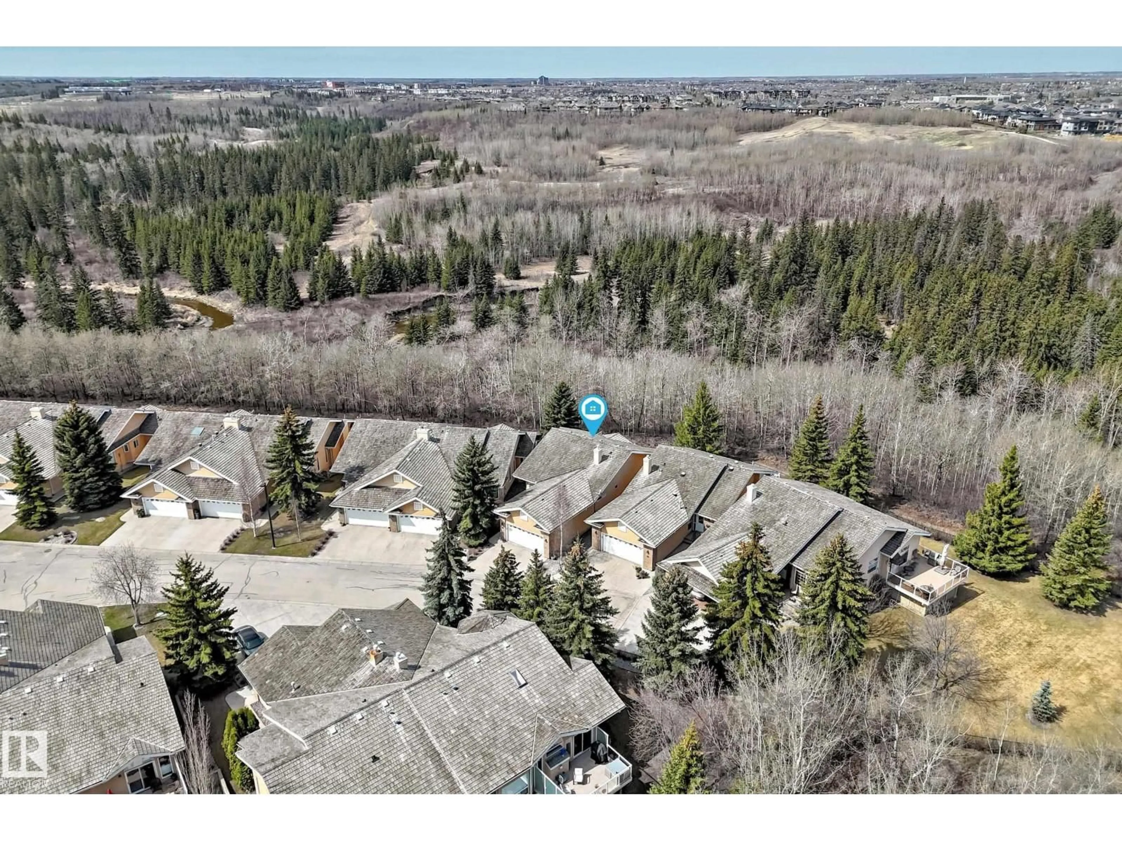 A pic from outside/outdoor area/front of a property/back of a property/a pic from drone, forest/trees view for 920 - 38 119 ST, Edmonton Alberta T6J7H2