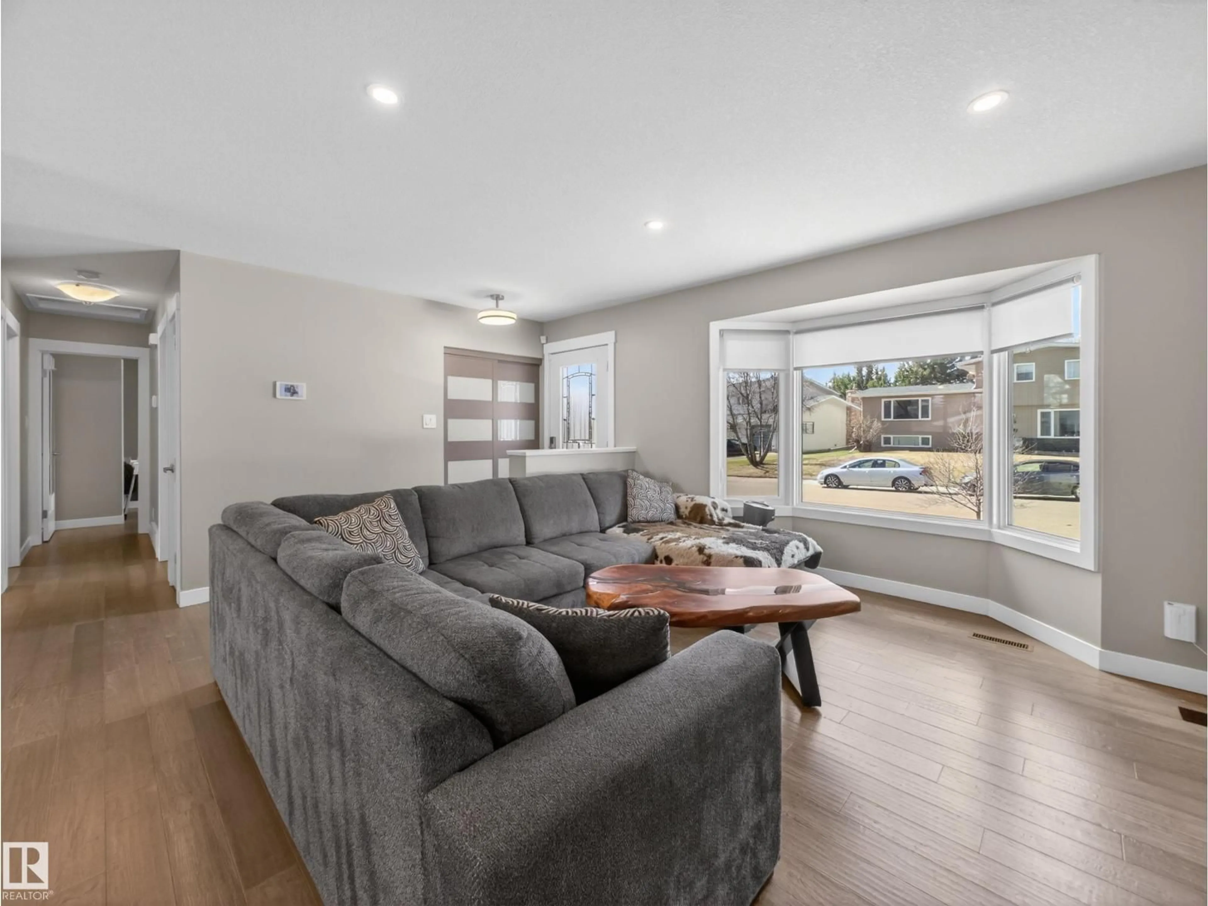 Living room with furniture, wood/laminate floor for 28 GLENGARRY CR, Sherwood Park Alberta T8A3A2