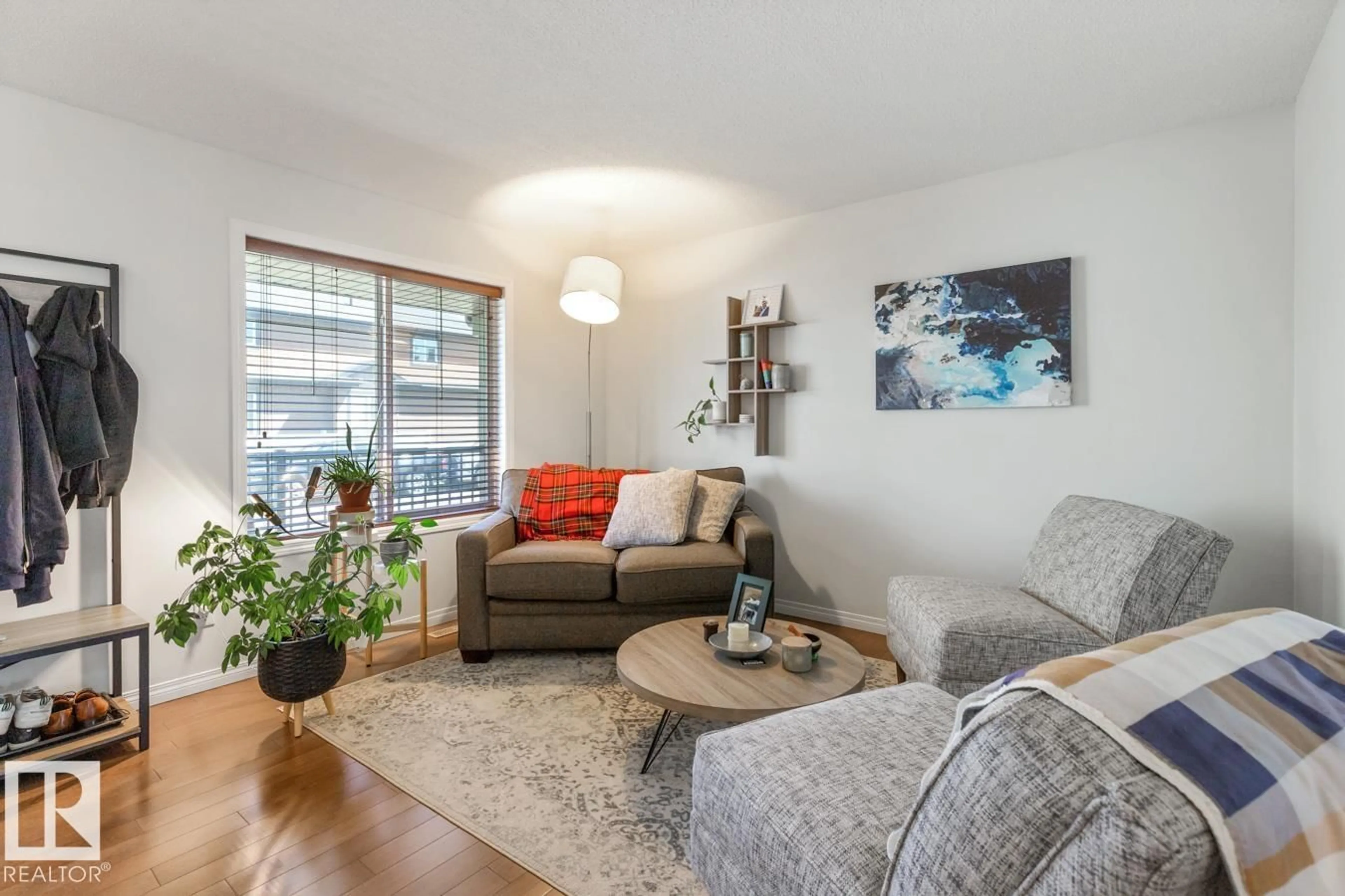 Living room with furniture, wood/laminate floor for 7641 SCHMID CR, Edmonton Alberta T6R0K8