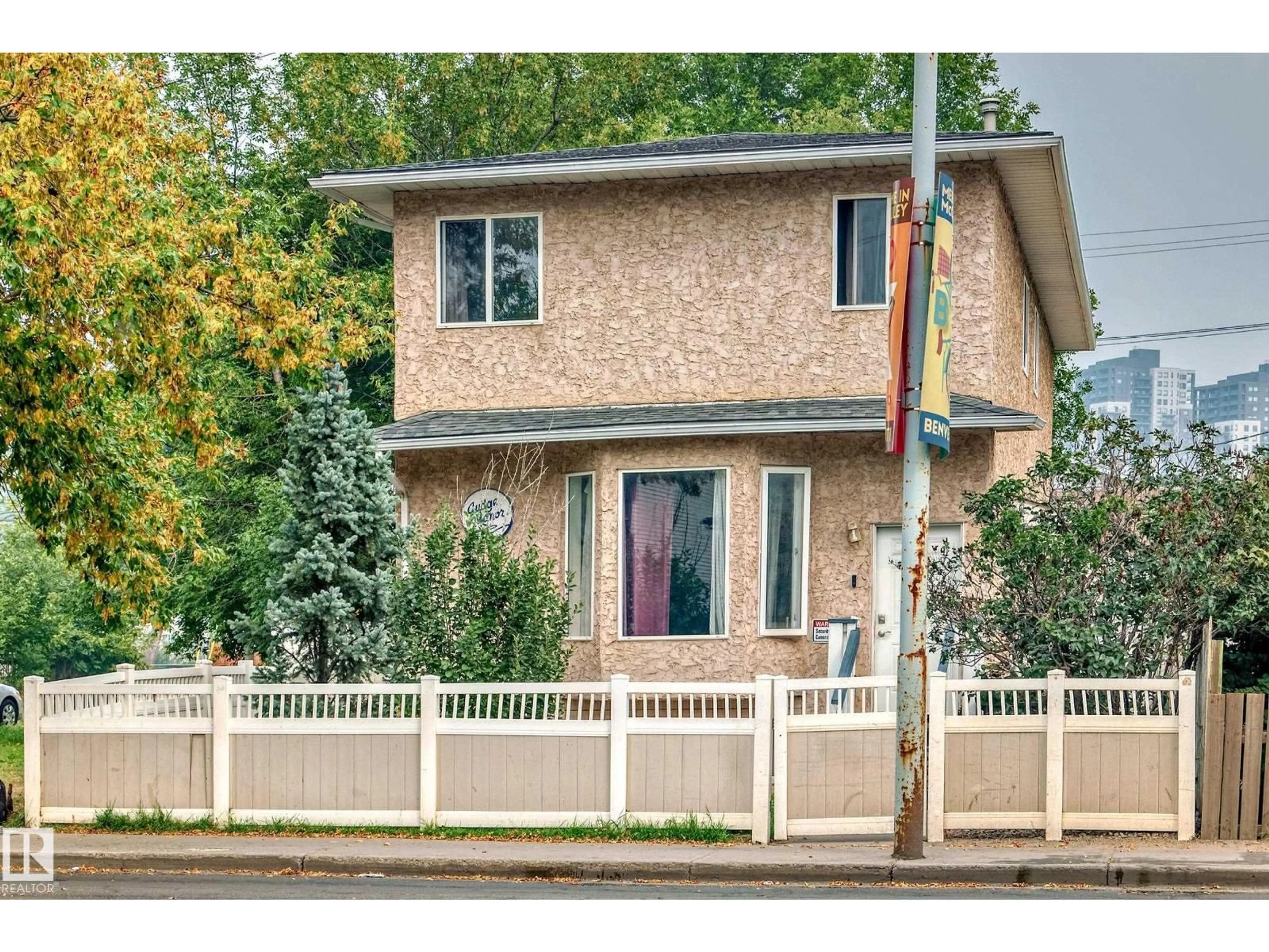 Home with vinyl exterior material, street for NW - 10711A 95 ST, Edmonton Alberta T5H2C8