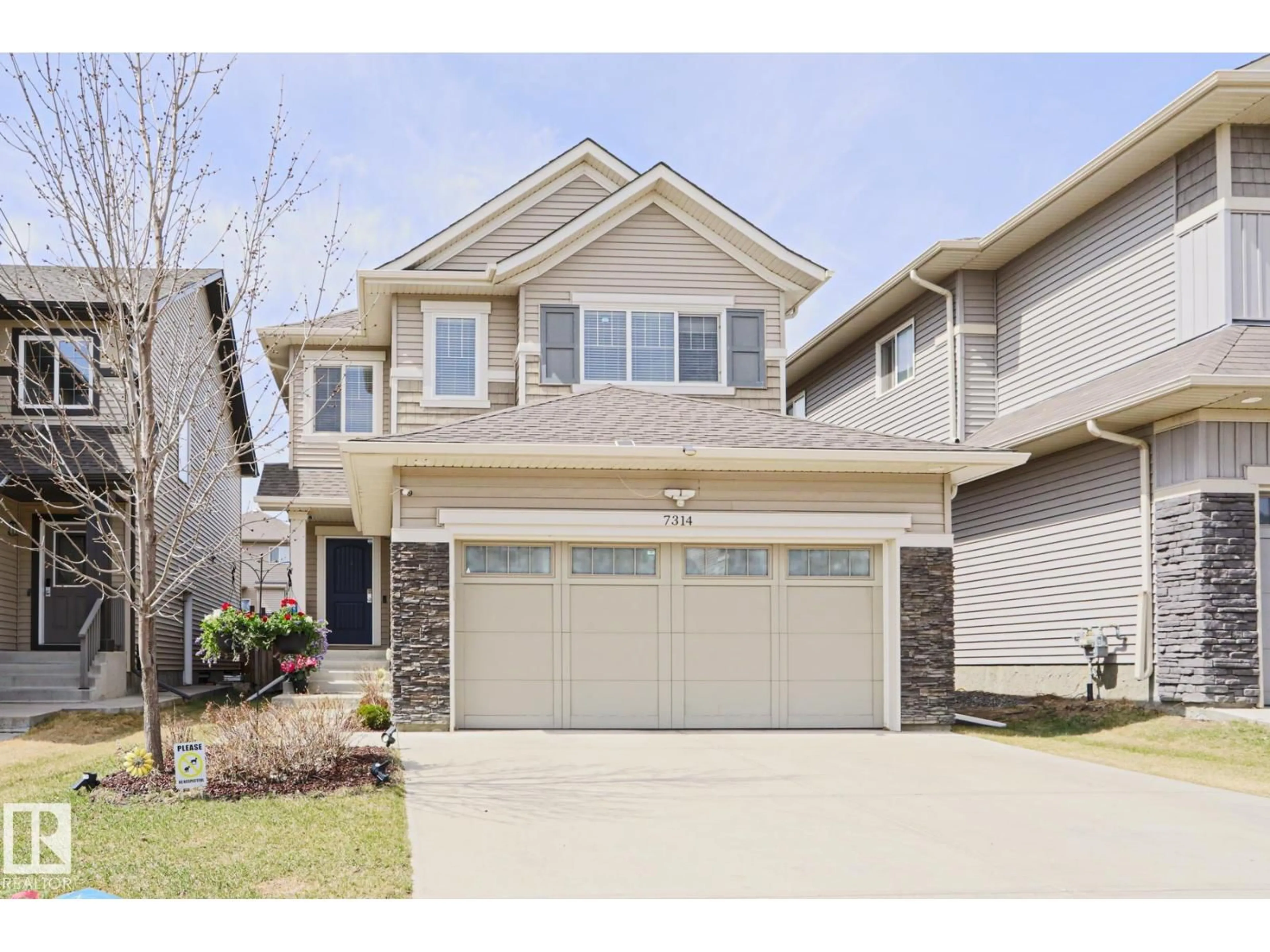 Home with vinyl exterior material, street for 7314 EDGEMONT WY, Edmonton Alberta T6M0S1