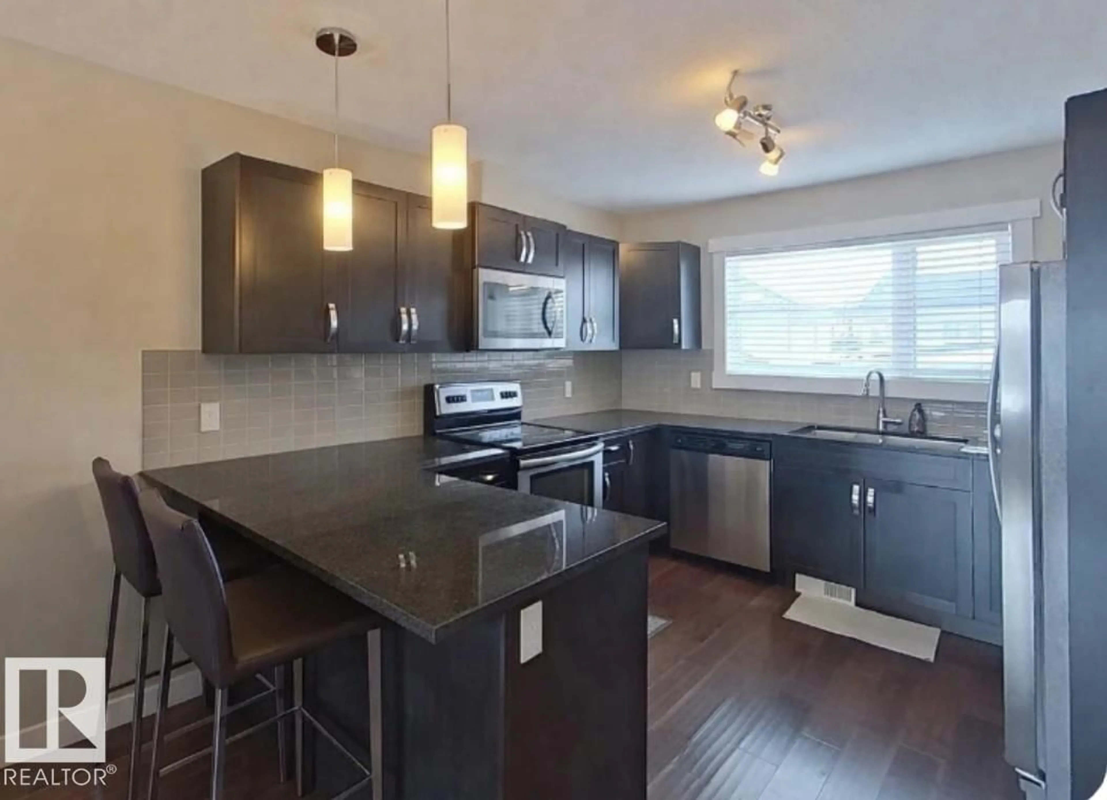 Open concept kitchen, wood/laminate floor for 295 401 SOUTHFORK, Leduc Alberta T9E0X1