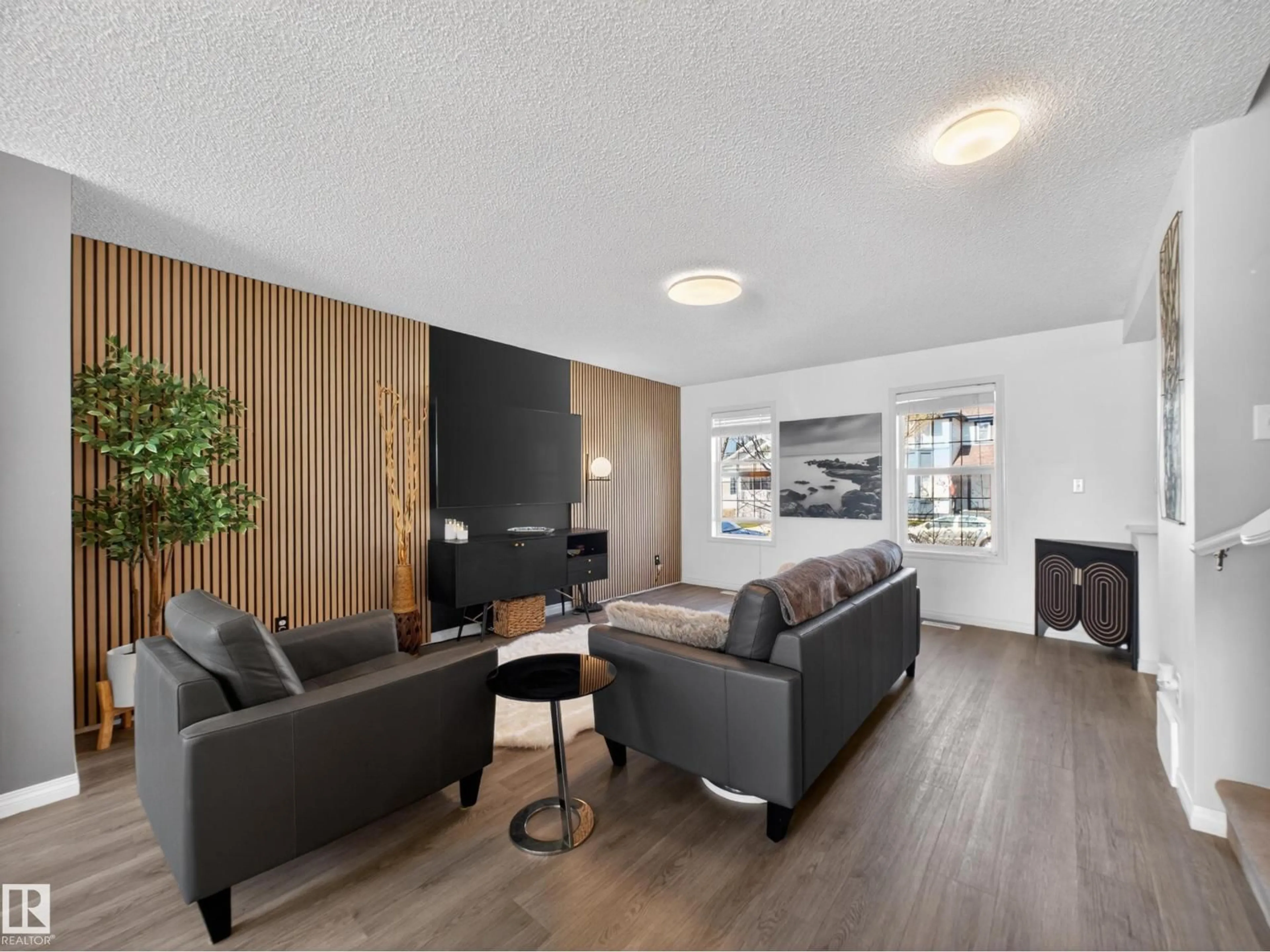 Living room with furniture, wood/laminate floor for NW - 5576 STEVENS CR, Edmonton Alberta T6R0A3