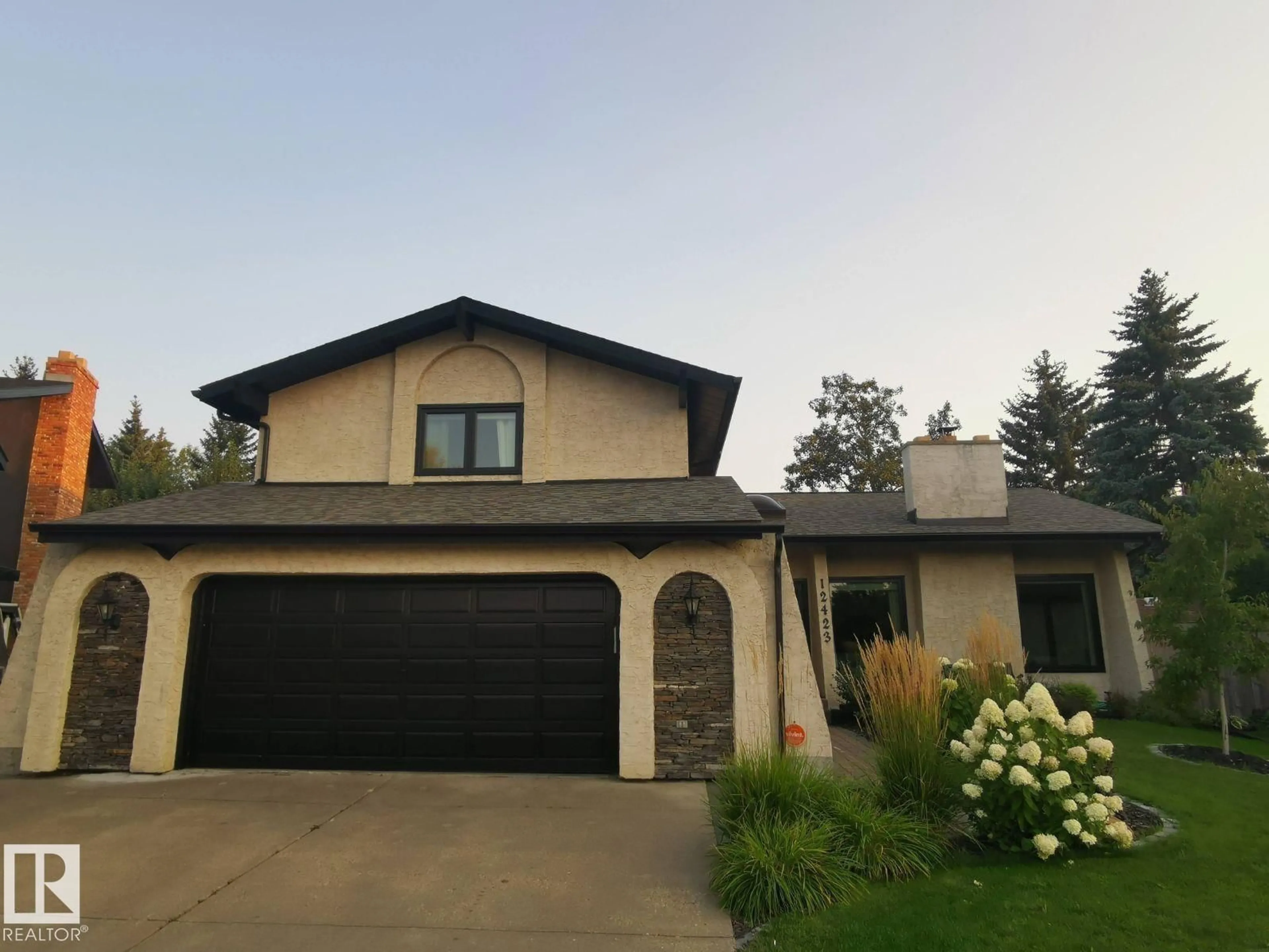 Home with vinyl exterior material, street for 12423 28A AV, Edmonton Alberta T6J4L5