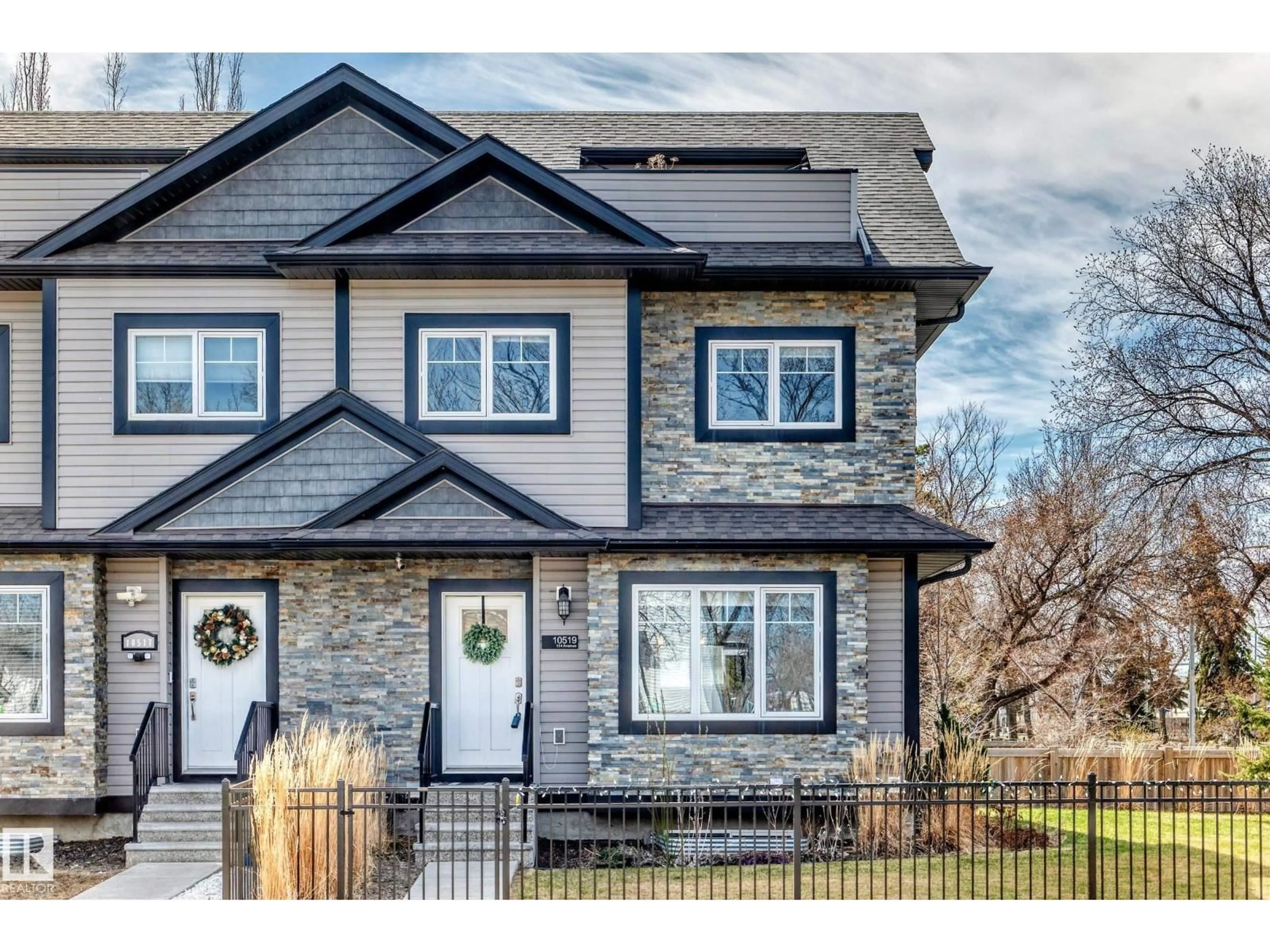 Home with vinyl exterior material, street for 10519 114 AV, Edmonton Alberta T5G1Z4
